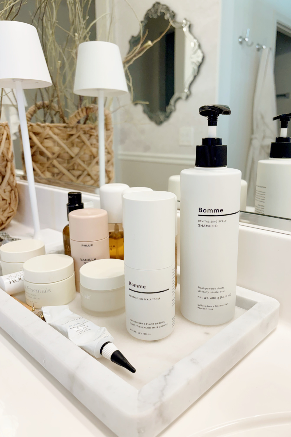 Hello Lovely's bath vanity with Bomme Revitalizing Scalp Shampoo and Toner. #hairhealth #hairgrowth