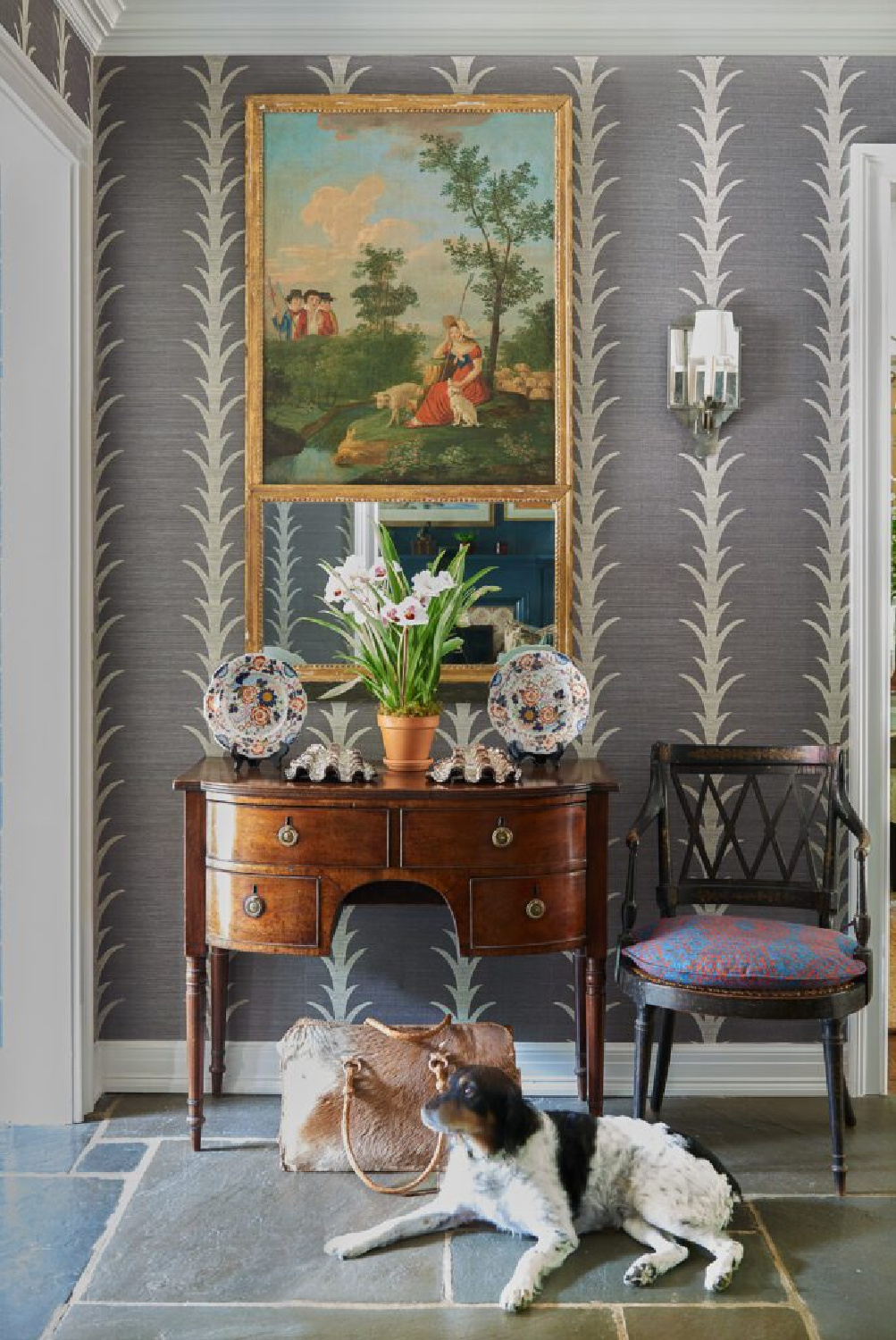 Acanthus wallpaper in a classically elegant entry with antique console and interior design by Brittany Bromley.