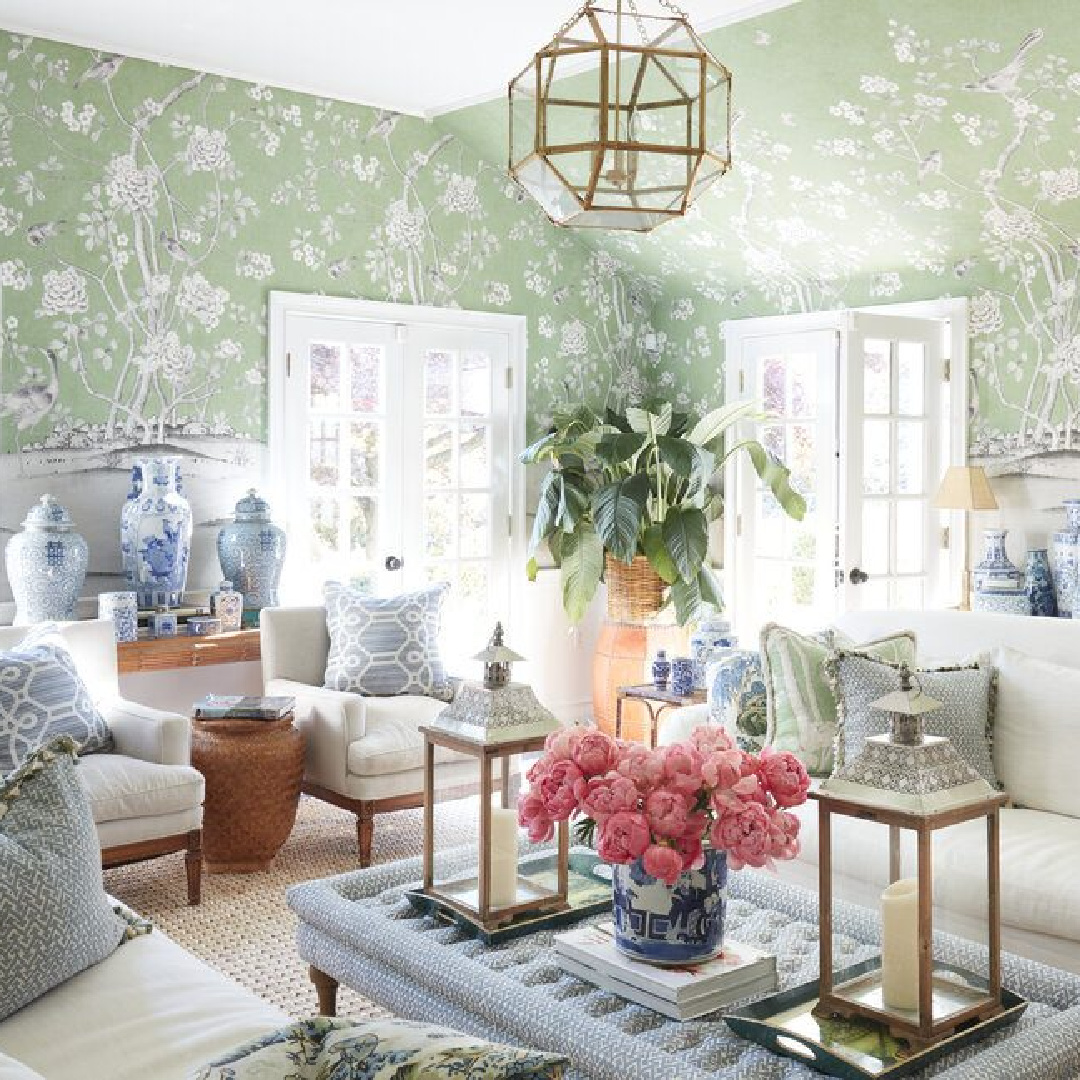 The ultimate Chinoiserie chic with green and blue handpainted wallpaper, porcelain, French doors, and design by Brittany Bromley.