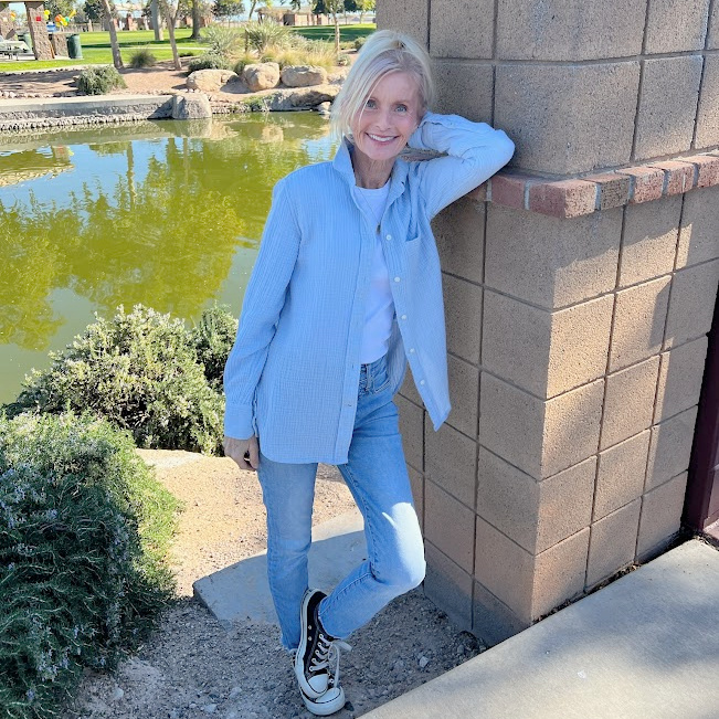 Michele of Hello Lovely in light blue near pond.