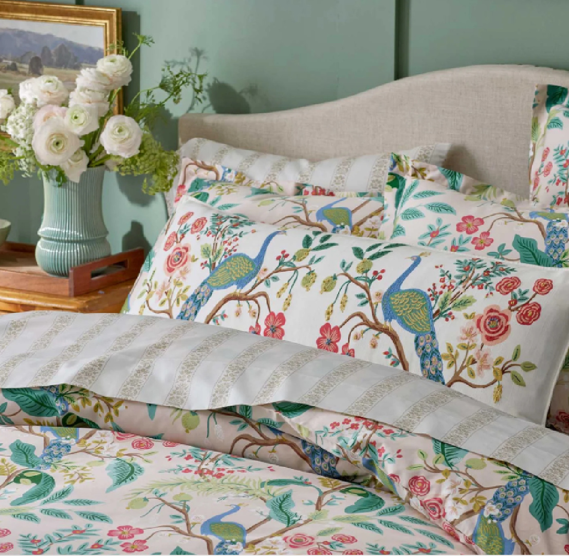 Peacock Blush Duvet Cover and pillows, Rifle Paper Co. in a lovely bedroom with frosty French green wainscot.