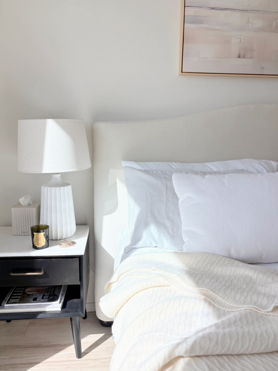 Hello Lovely's serene Arizona bedroom with Pottery Barn velvet headboard and Silverlyne's ultra soft beige throw blanket.