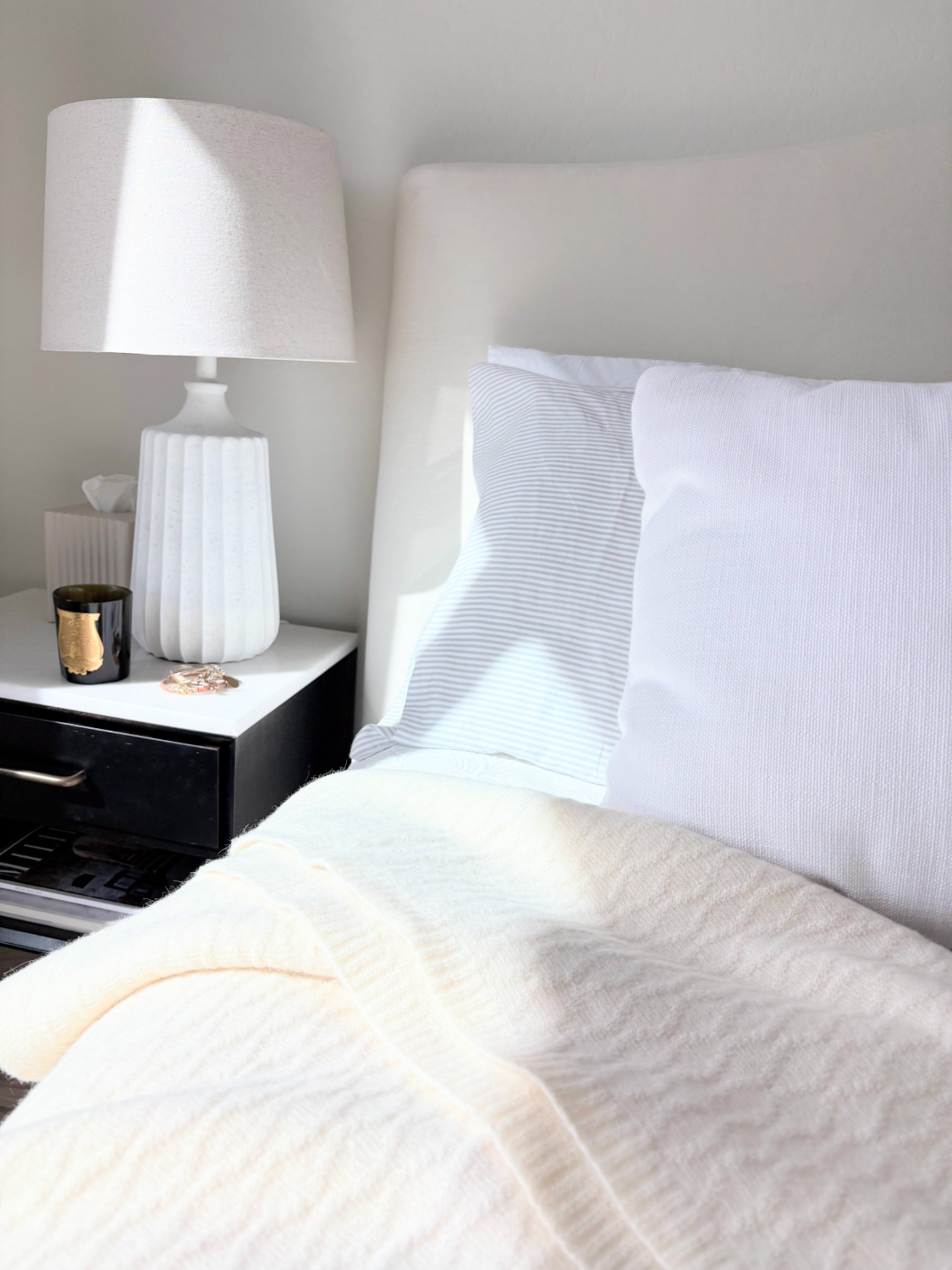 Hello Lovely's serene Arizona bedroom with Pottery Barn velvet headboard and Silverlyne's ultra soft beige throw blanket.