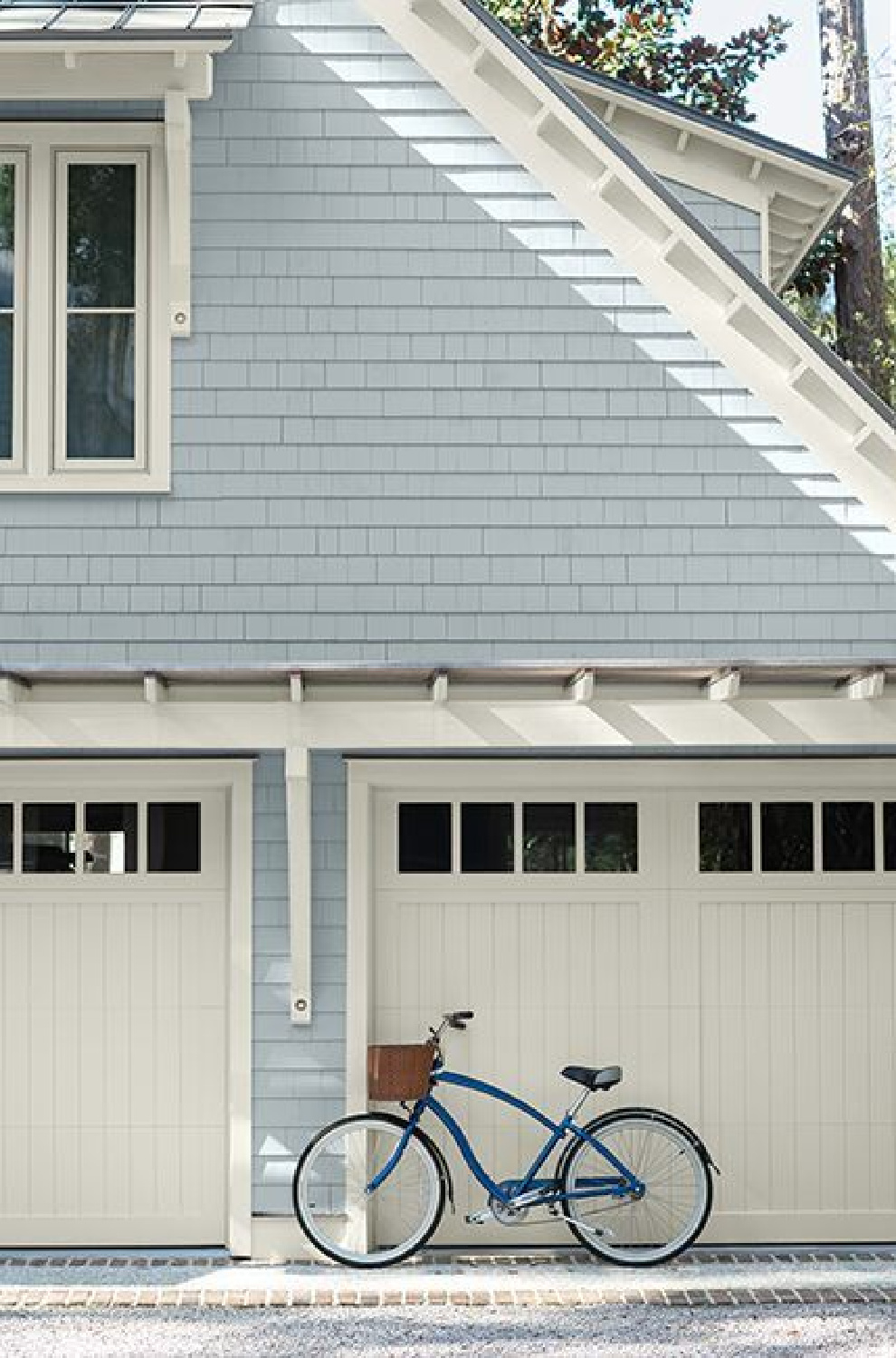 Benjamin Moore blue shingles on coastal style home's garage.
