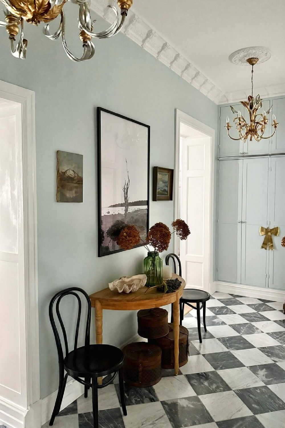 Farrow & Ball Borrowed Light in a beautiful hall with checkered floor - @seashellsandchandeliers.