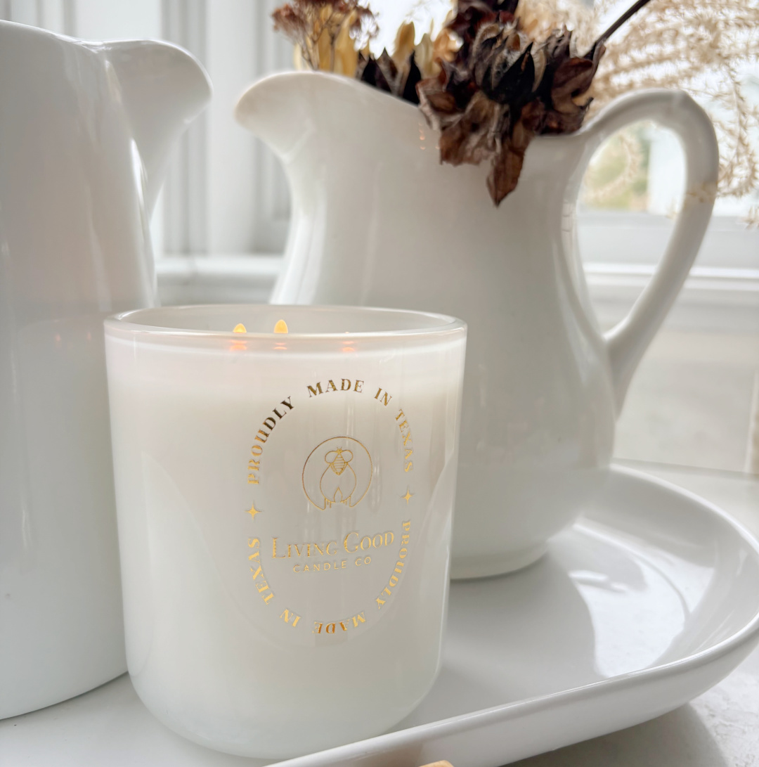 Hello Lovely's kitchen with vintage ironstone pitchers and Living Good Candle Co. Claricomb candle on white tray. #livinggoodcandleco