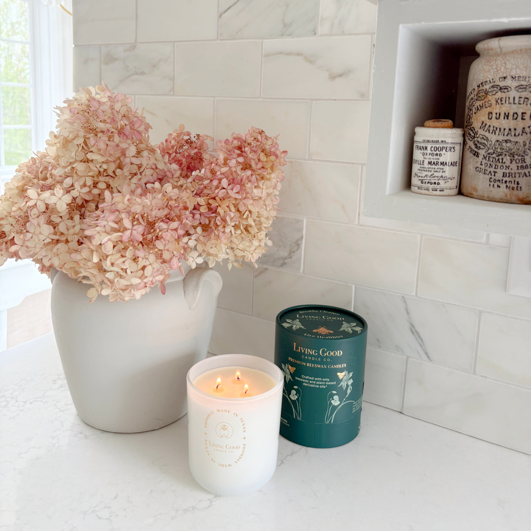 Hello Lovely's modern French kitchen with Muse quartz (Viatera/LX Hausys), calacatta marble backsplash, and Living Good Candle Co. Claricomb candle.