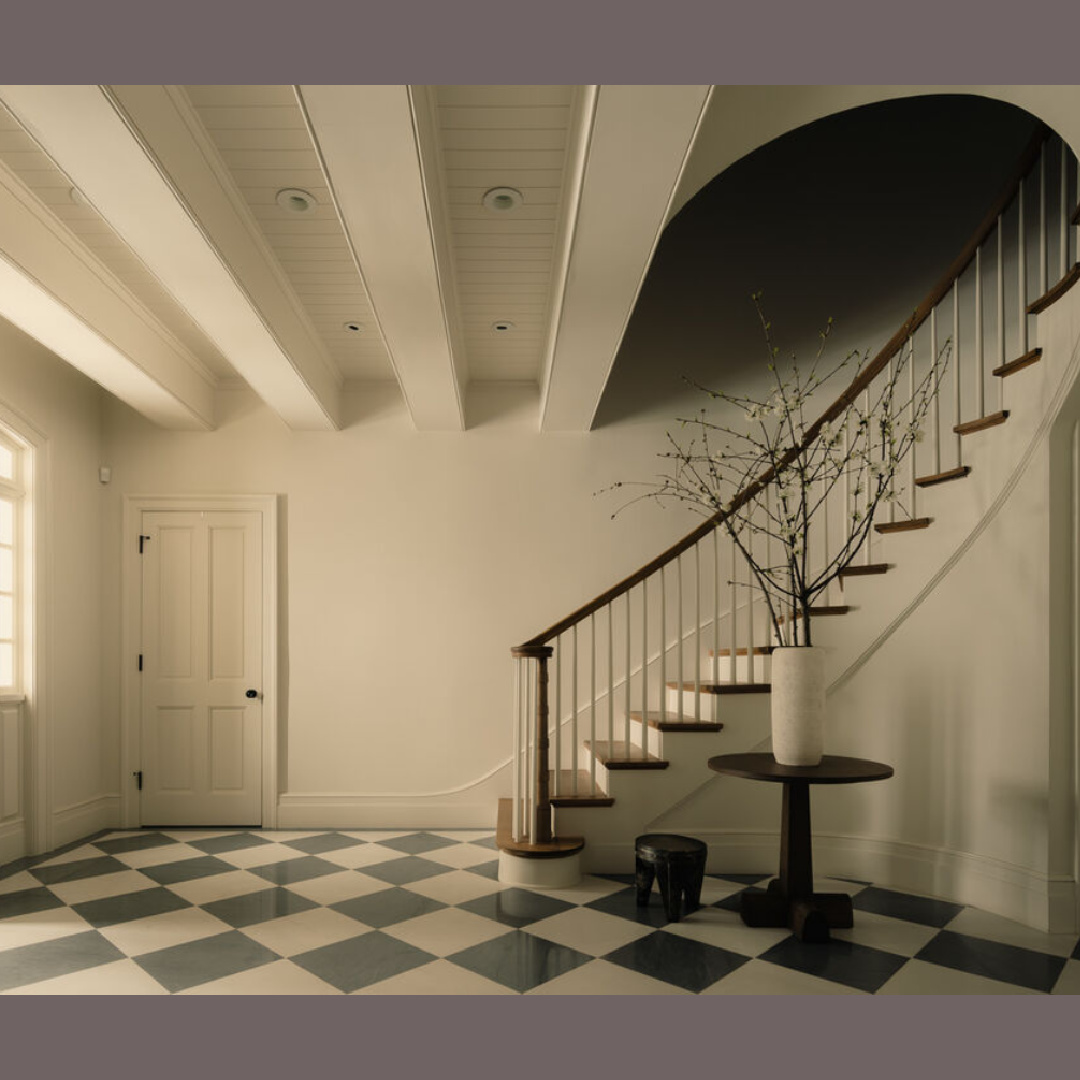 Checkerboard floor entry in serene entry. Modern French interiors (Clements Design) in a Hidden Hills, CA storybook home with neutral decor and famous occupants including Jennifer Lawrence, Jessica Simpson, and Ellen DeGeneres.