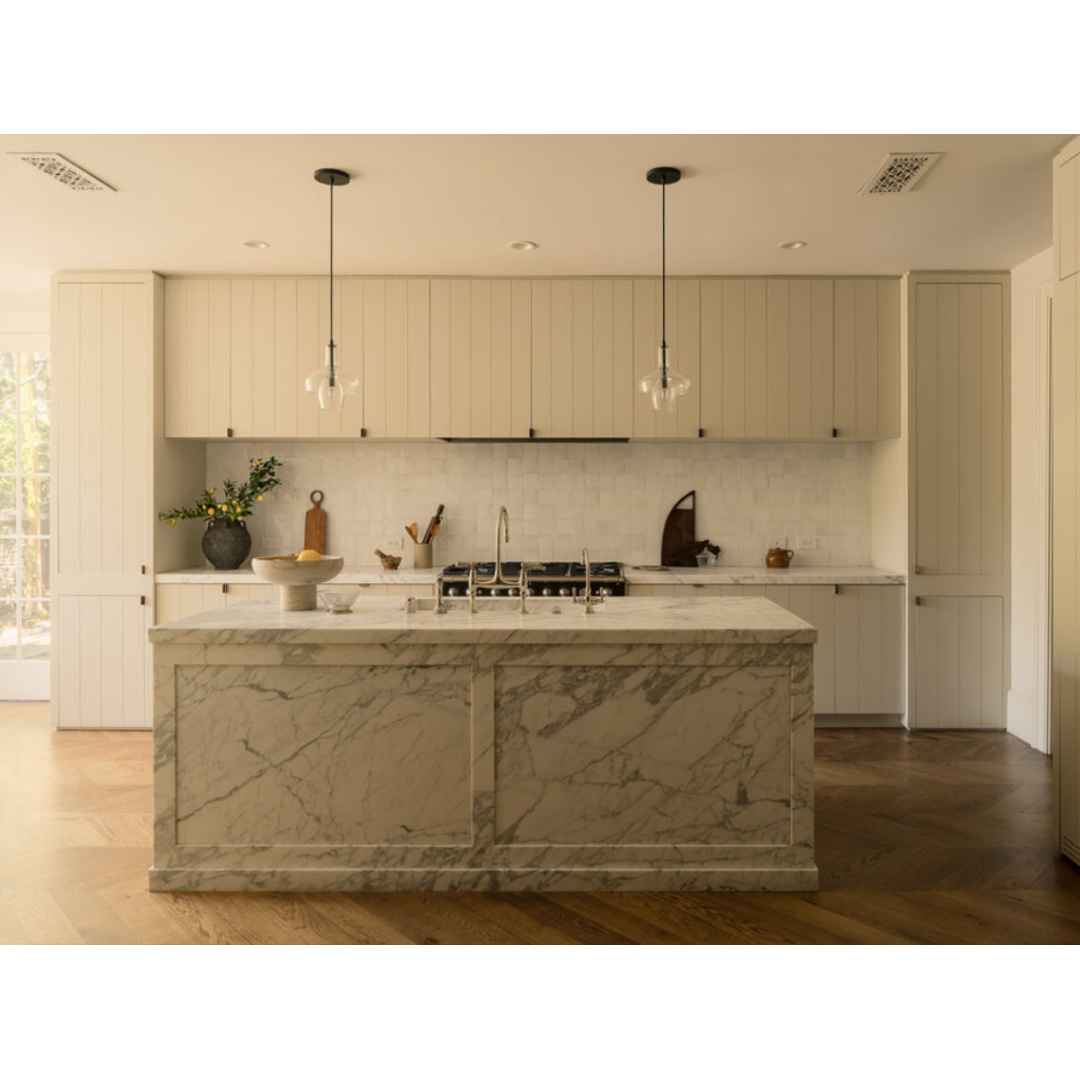 Modern minimal kitchen with putty tones (Clements Design) in a Hidden Hills, CA storybook home with neutral decor and famous occupants including Jennifer Lawrence, Jessica Simpson, and Ellen DeGeneres - Realtor.com