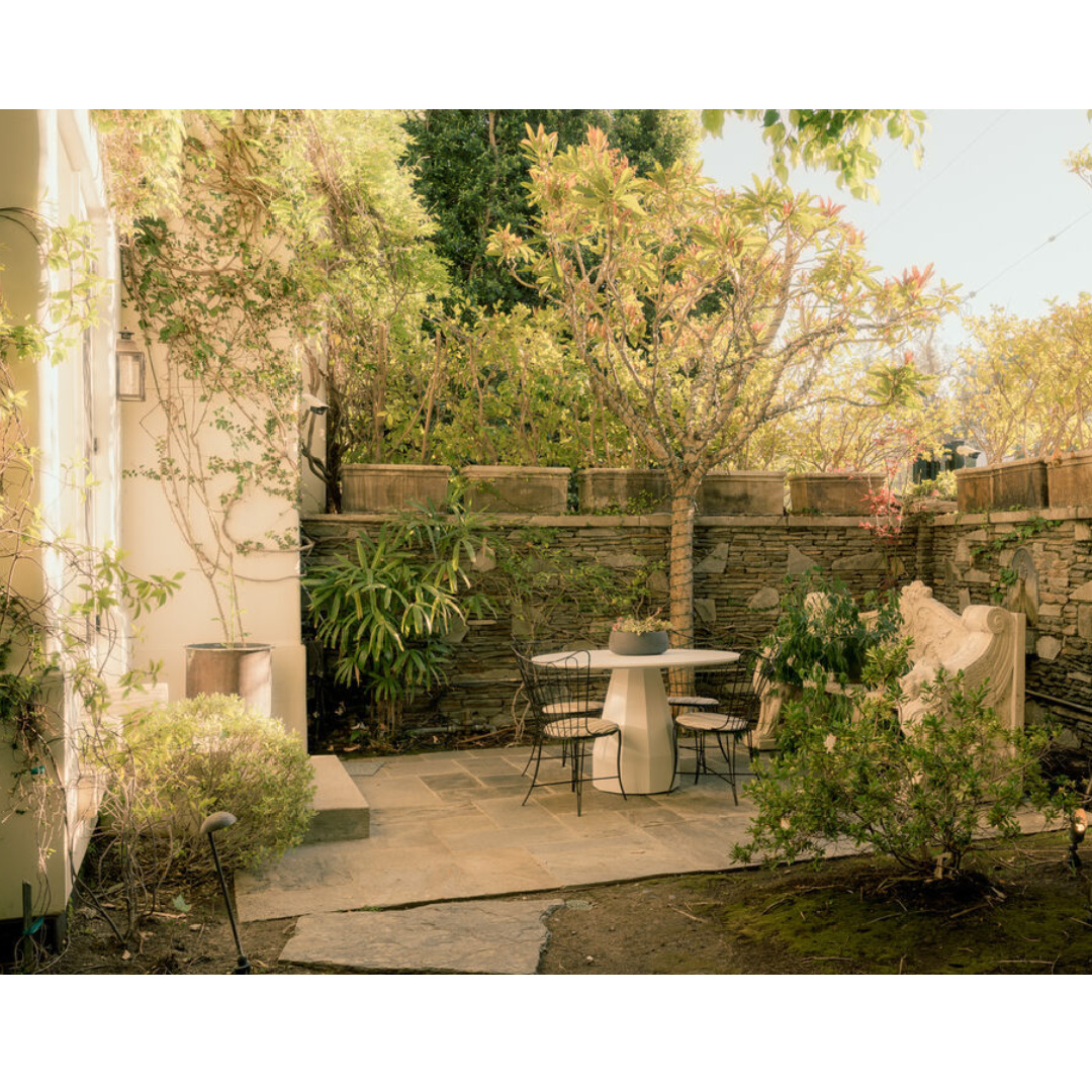 Patio with minimal design - Modern French interiors (Clements Design) in a Hidden Hills, CA storybook home with neutral decor and famous occupants including Jennifer Lawrence, Jessica Simpson, and Ellen DeGeneres - Realtor.com