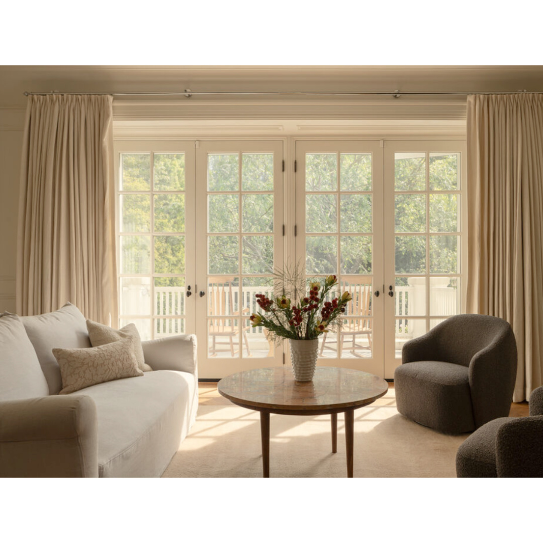 Modern French sitting area of bedroom (Clements Design) in a Hidden Hills, CA storybook home with neutral decor and famous owners including Jennifer Lawrence, Jessica Simpson, and Ellen DeGeneres - Realtor.com