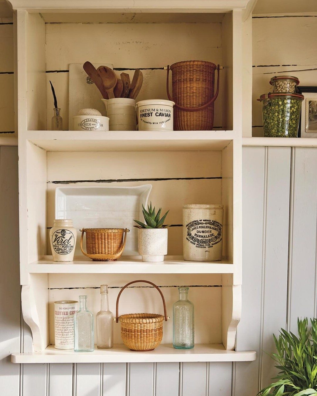 Kitchen shelves in a Nantucket coastal cottage - Lydia Cottage in Coastal Living magazine.