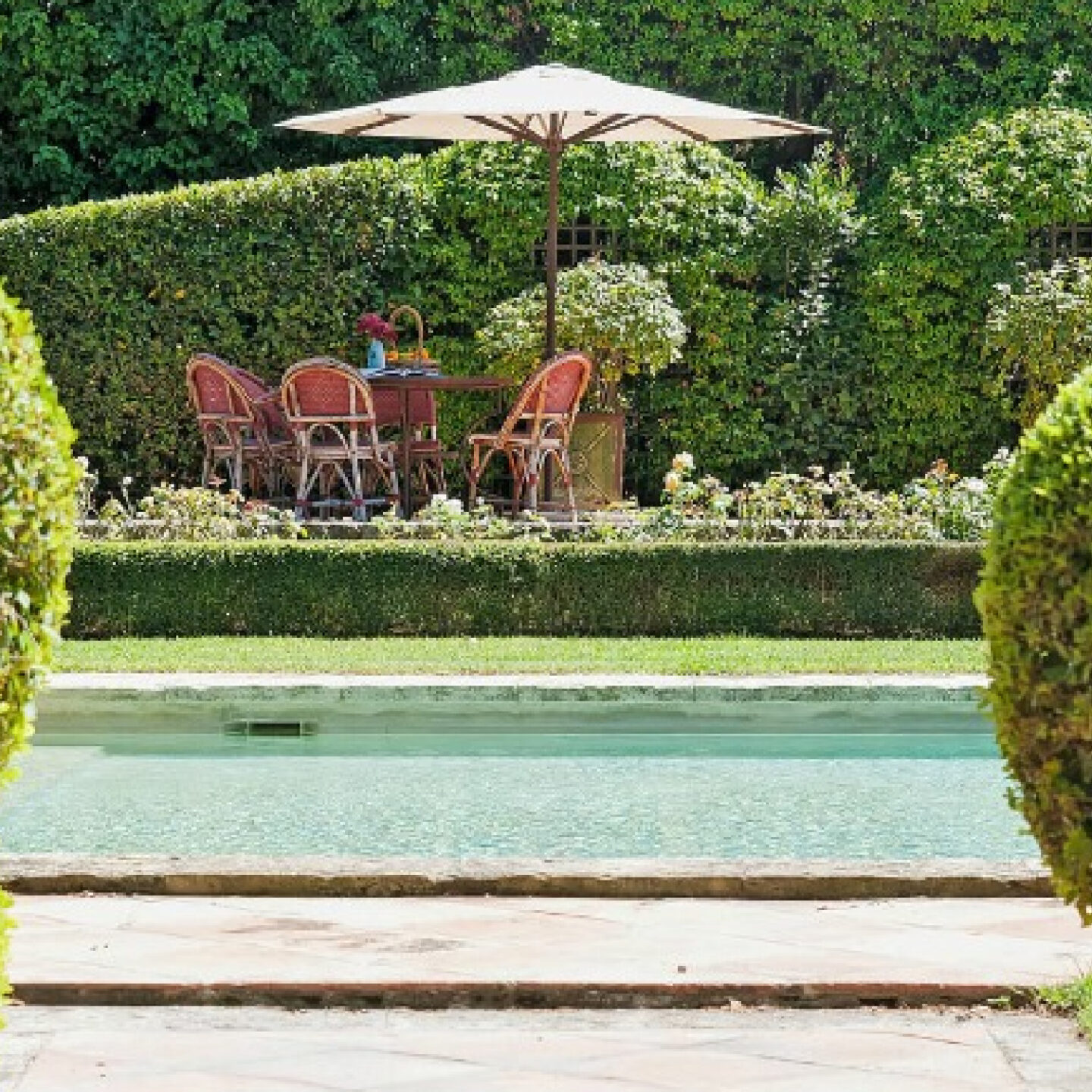 Traditional French country gardens, courtyard and pool at South of France property Chateau Mireille - Your Haven In.