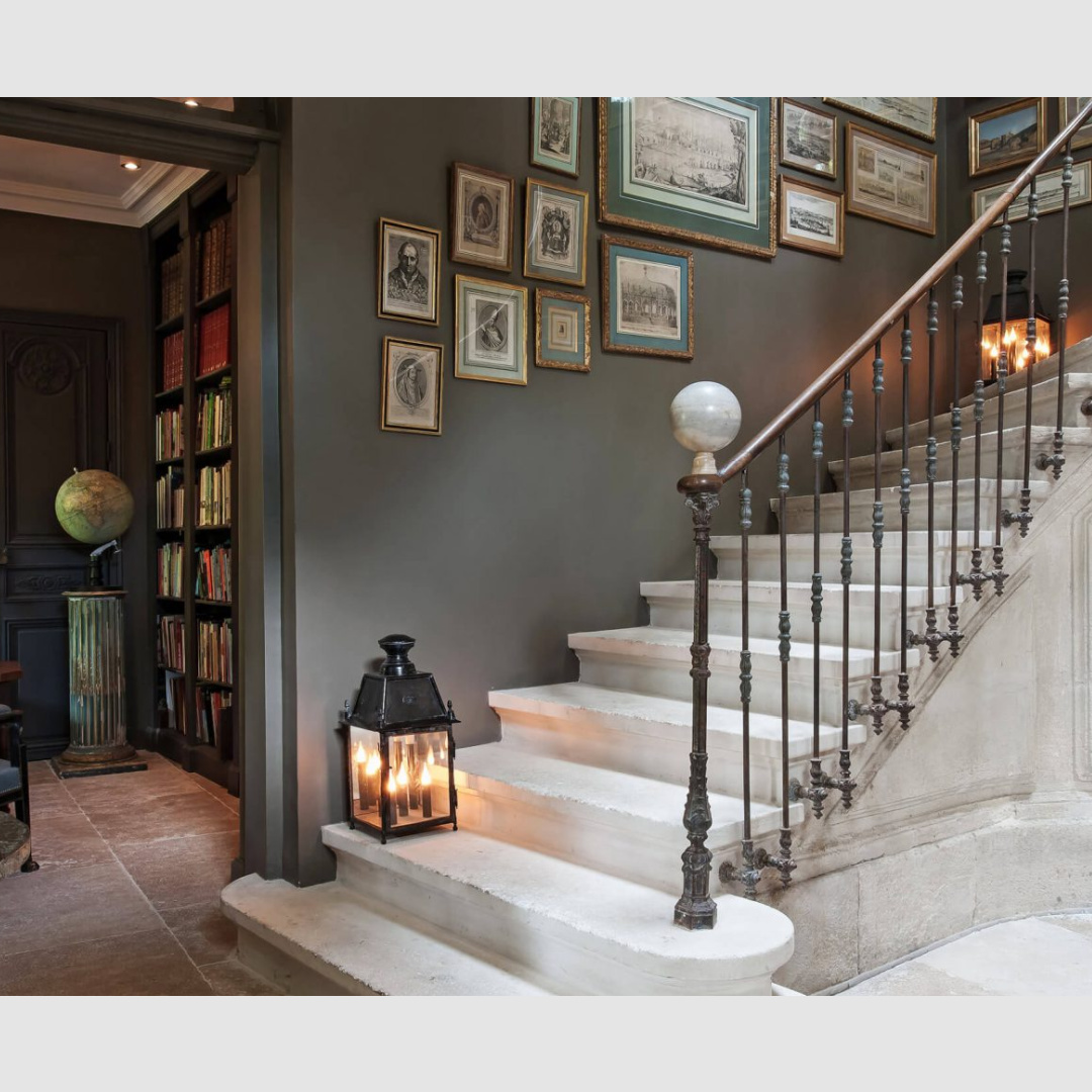 Grand stone staircase with gallery wall - Hotel Particulier in Avignon - La Divine Comedie restored chateau and guest house in South of France (Provence) - Your Haven In.