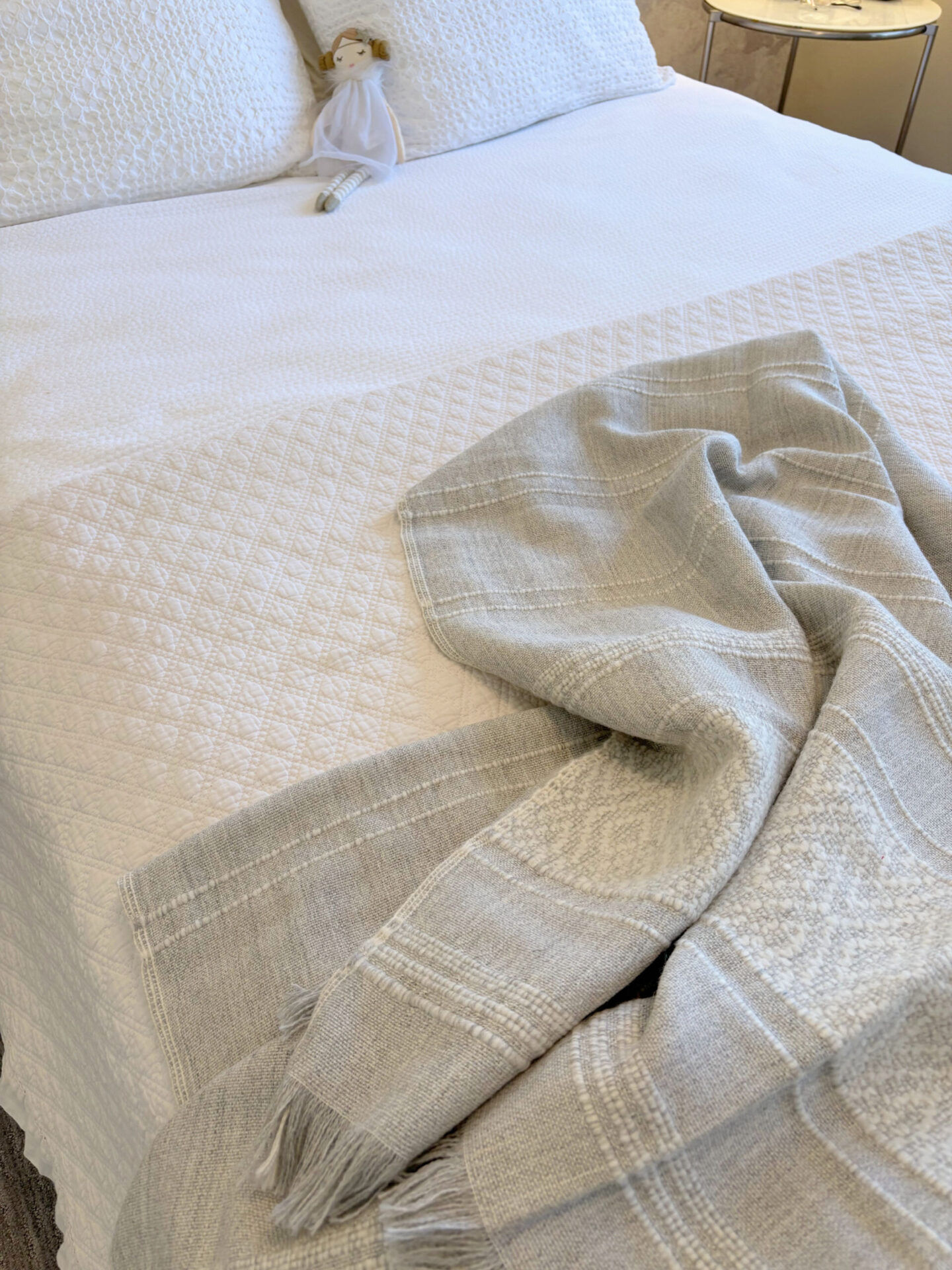 Hello Lovely's superfine alpaca handwoven throw in light grey and white by Purple Nest Design is a timeless natural collectible treasure.