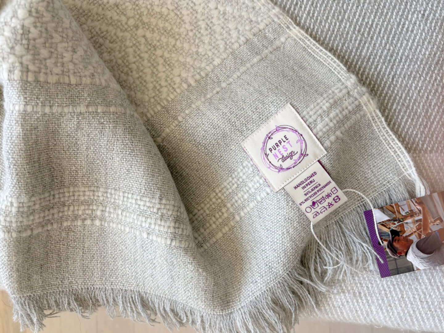 Hello Lovely's superfine alpaca handwoven throw in light grey and white by Purple Nest Design is a timeless natural collectible treasure.