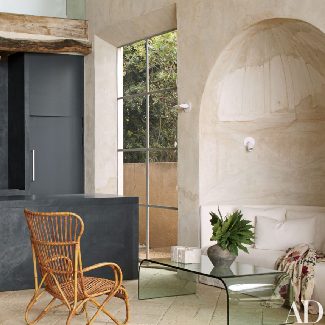 Arched stone breakfast nook and black kitchen in Richard Shapiro's masterful Old World seaside home in Malibu in AD's April 2011 issue.