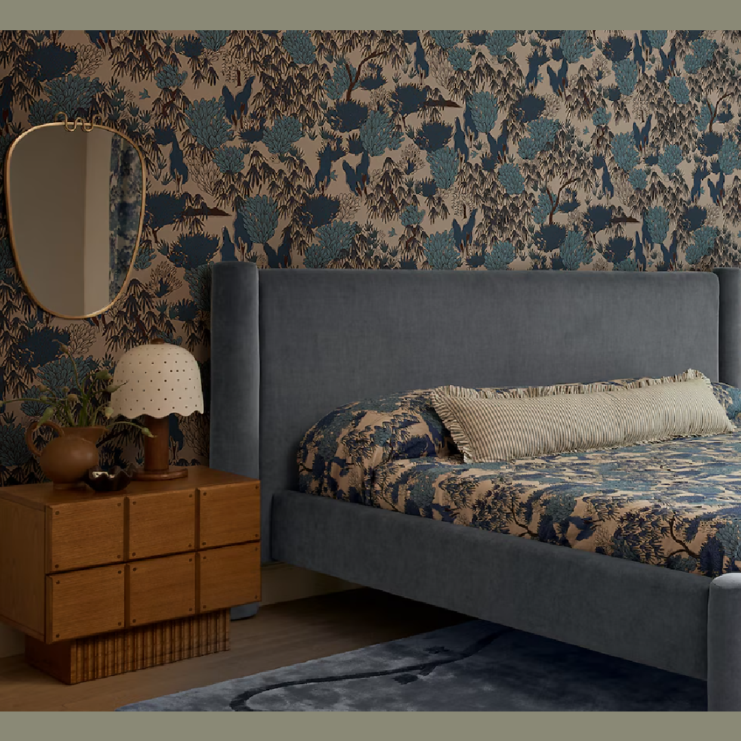 Isla long lumbar pillow on bed in beautiful blue patterned pattern in a bedroom designed by Sarah Sherman Samuel for Lulu & Georgia.