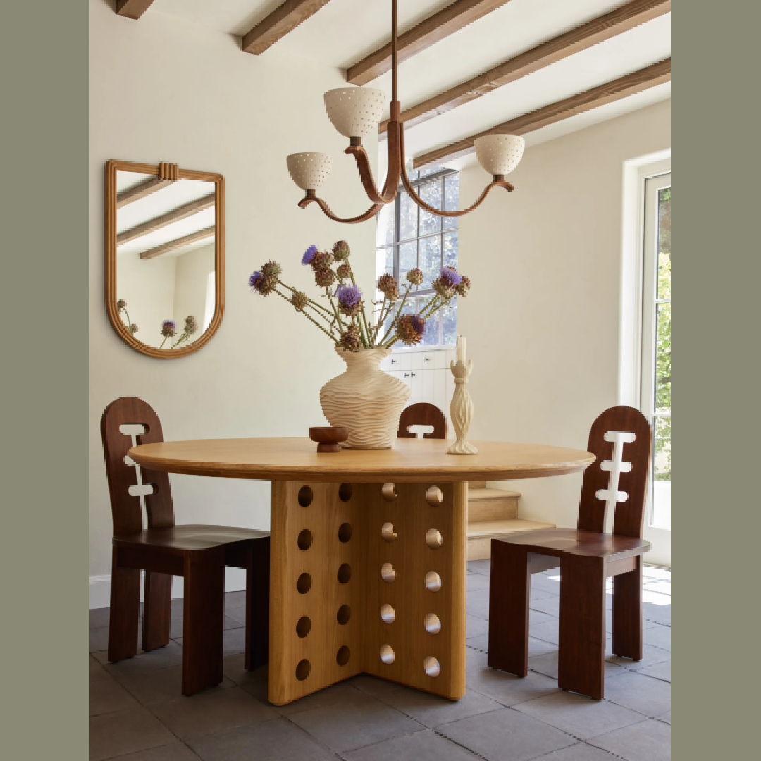 Dining room with modern earthy warm style and Reika Round Dining Table designed by Sarah Sherman Samuel for Lulu & Georgia.