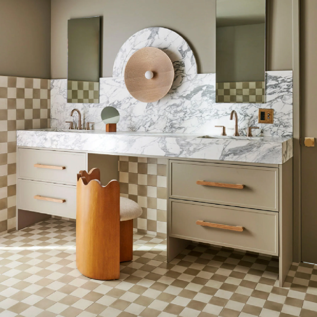 Green checkered tile floor in whimsical, geometric, modern bath with vanity area and Ripple Accent Chair by Sarah Sherman Samuel for Lulu & Georgia.