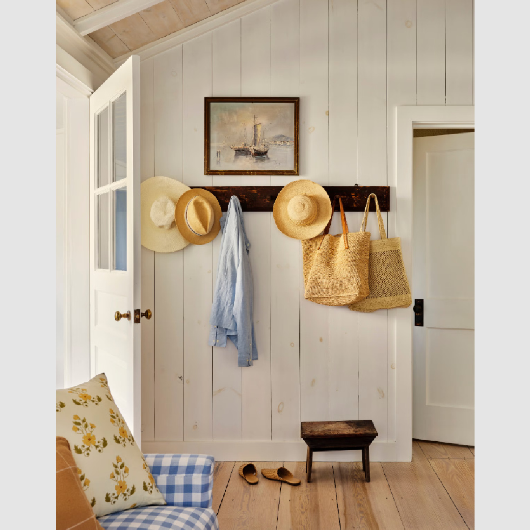 Whitewashed tongue and groove pine entry in a beach cottage by Wildflower Home (Marynn) featured in Country Living.