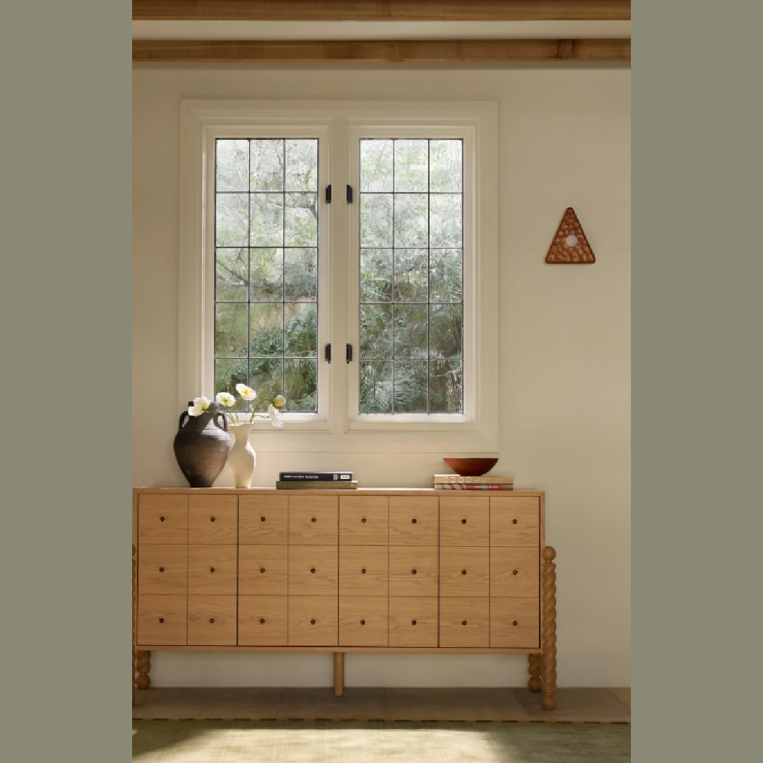 Serene console with Kolmio sconce on wall and design by Sarah Sherman Samuel with her Wrinkle Vase for Lulu & Georgia.