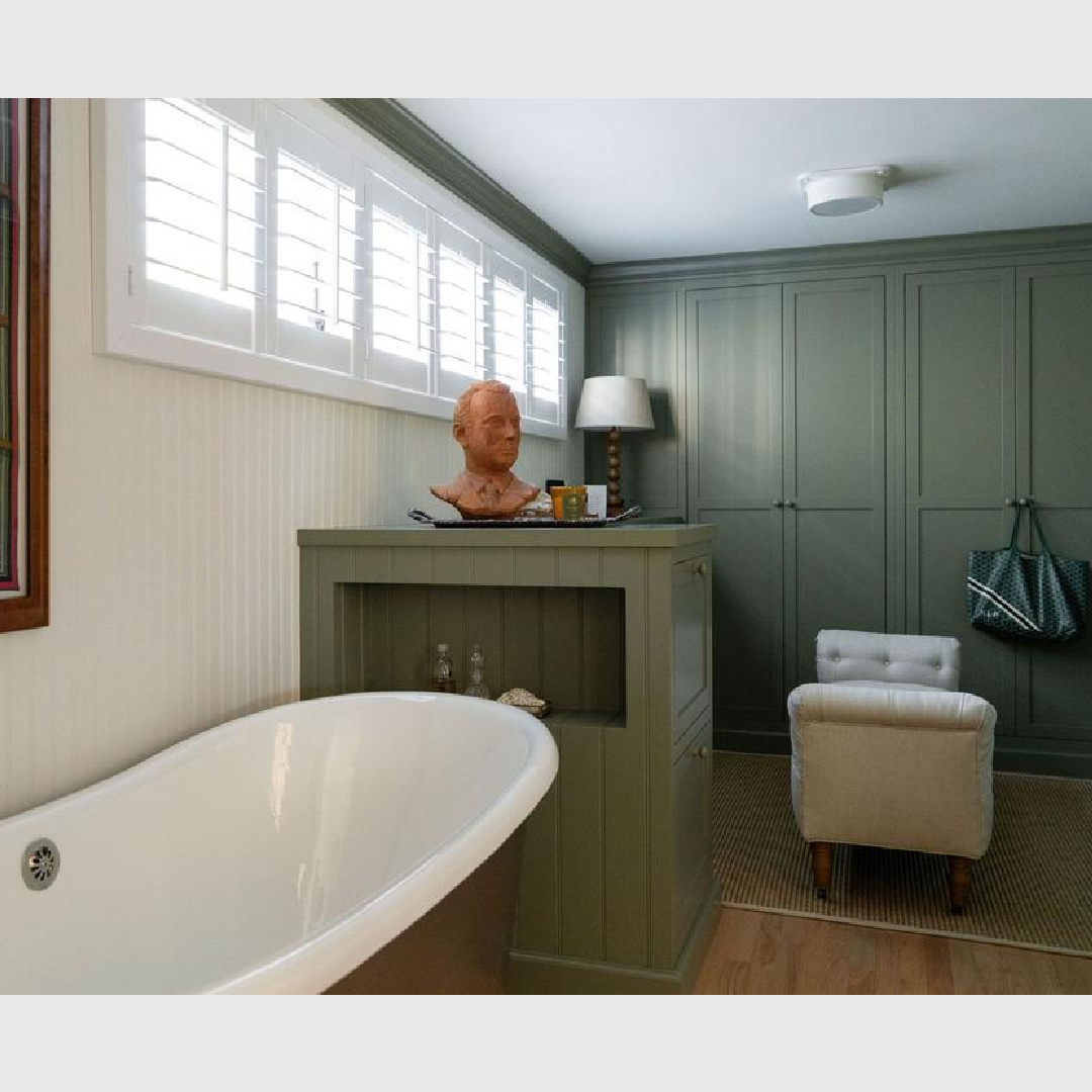 Warm moody green wardrobes in dressing area of a beach cottage bath with soaking tub and English Country style - Avi Brosh and Kirsten Leigh Pratt.