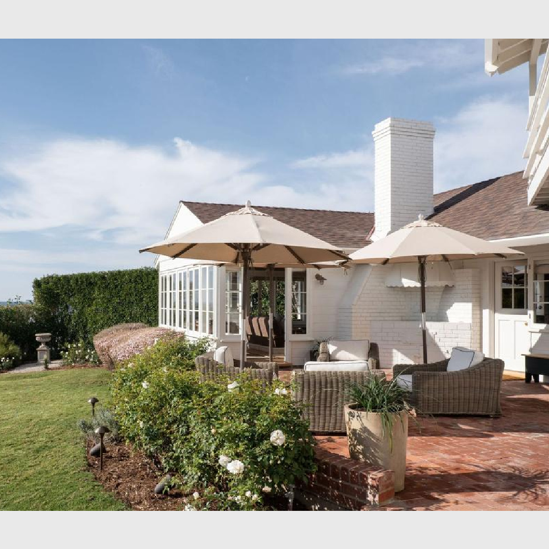 Garden and patio at 1941 Malibu white brick Cape Cod cottage - Avi Brosh and Kirsten Leigh Pratt. Vogue Living Australia - photo: Caylon Hackwith.