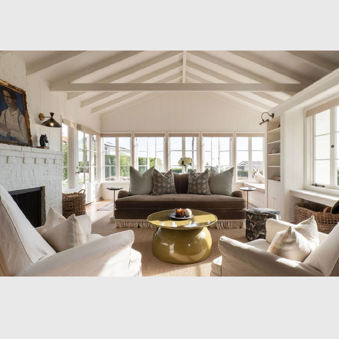 Cottage living room painted F&B All White with brown sofa. Malibu cottage with English Country interiors - Avi Brosh and Kirsten Leigh Pratt. Vogue Living Australia.