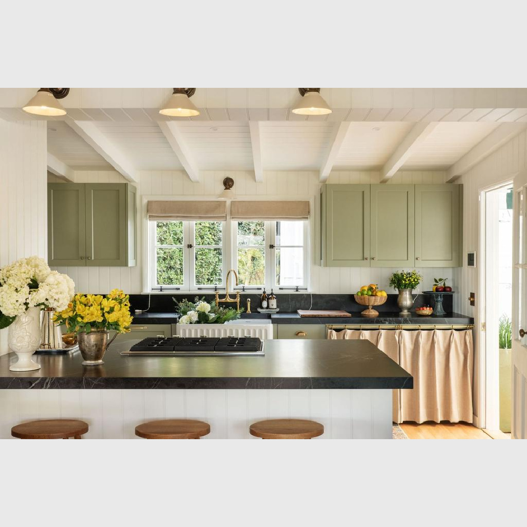 Earthy warm green kitchen cabinets within a 1941 Cape Cod style cottage kitchenin Malibu with walls painted Farrow & Ball All White. Avi Brosh and Kirsten Leigh Pratt. Vogue Living Australia. #englishcountrykitchen