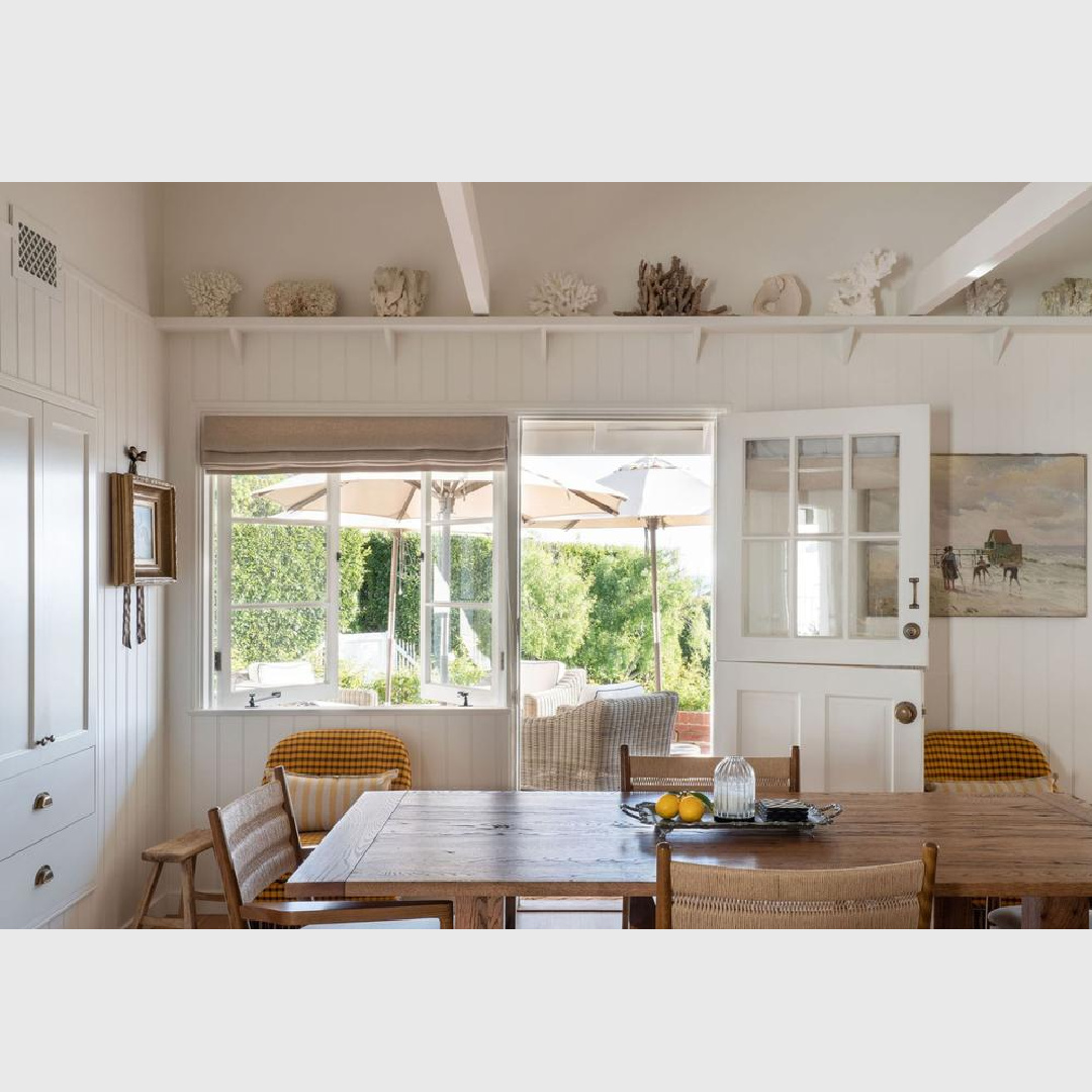 Natural light and Dutch door in a charming breakfast area with tongue and groove painted Farrow & Ball All White. Avi Brosh and Kirsten Leigh Pratt. Vogue Living Australia - photo: Caylon Hackwith. #beachhouse #farrowandballallwhite