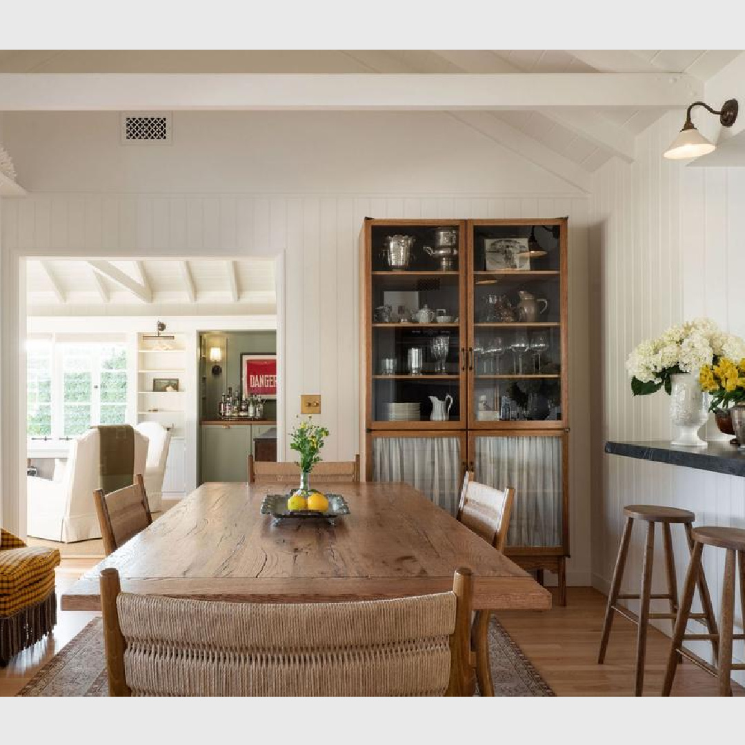 Farrow & Ball All White painted tongue and groove walls in a dining room with a mix of vintage at a 1941 Cape Cod style home - Avi Brosh and Kirsten Leigh Pratt. Vogue Living Australia. #farrowandballallwhite