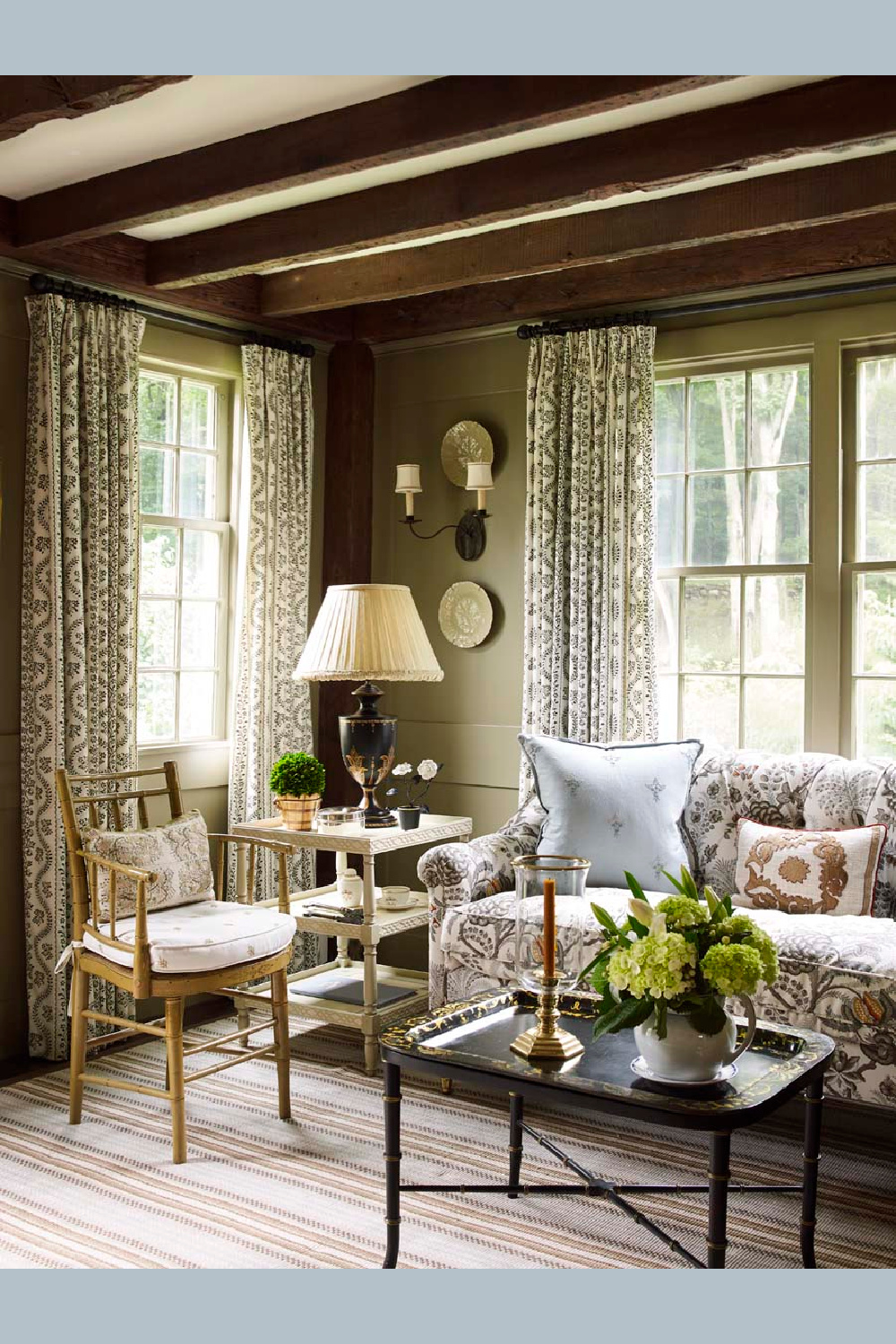 Sofa in dining area of Cathy Kincaid designed Connectictut river house with traditional timeless style.