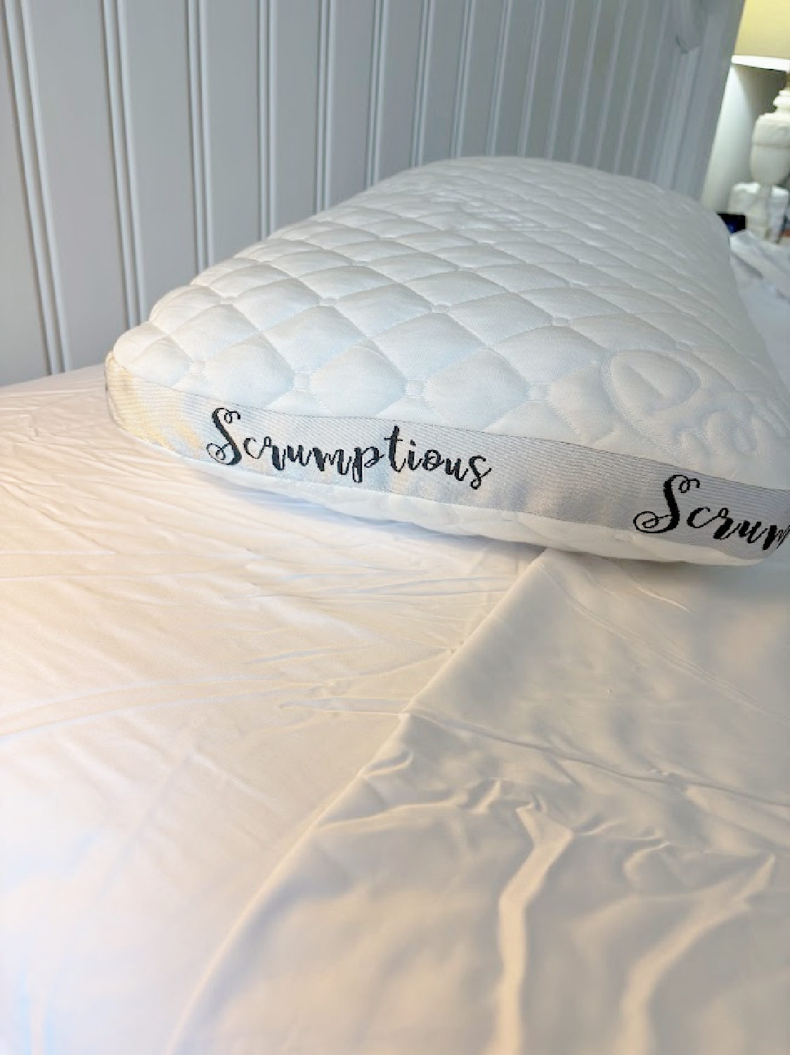 Hello Lovely's bedroom with Honeydew sheets and pillows on bed.