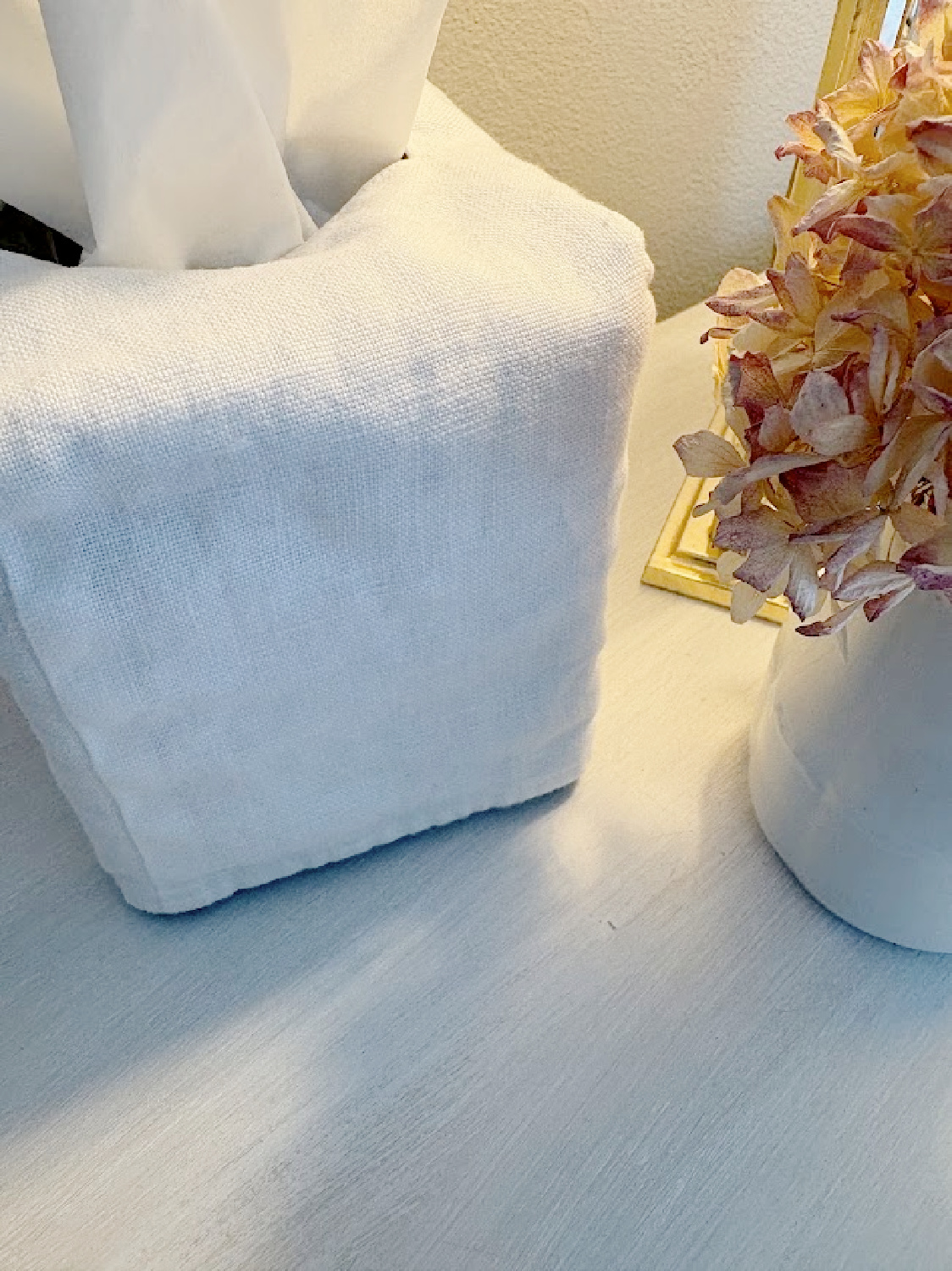 White linen slipcovered tissue box on Hello Lovely's nightstand at the Georgian.