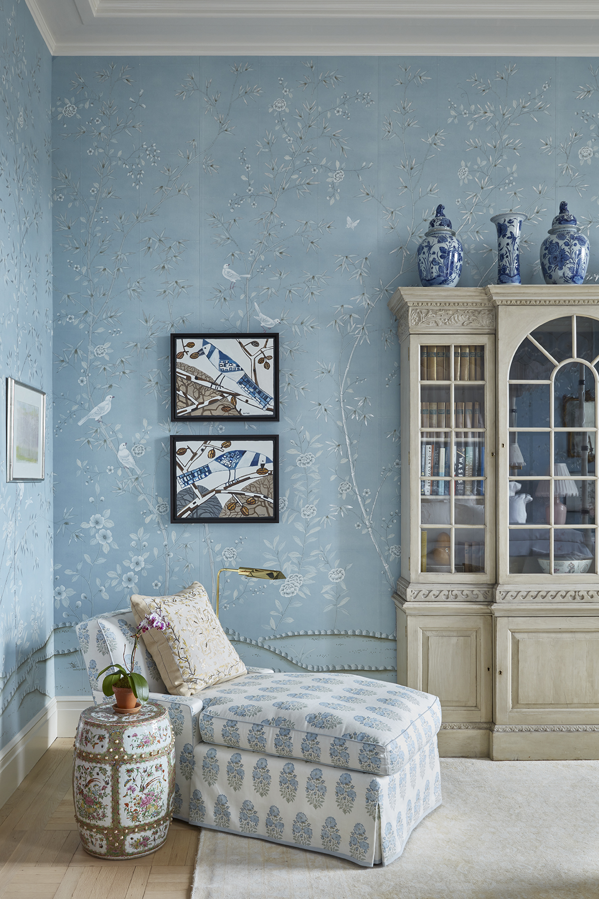 Chaise in bedroom with blue de Gournay paper in a Cathy Kincaid designed Central Park home.