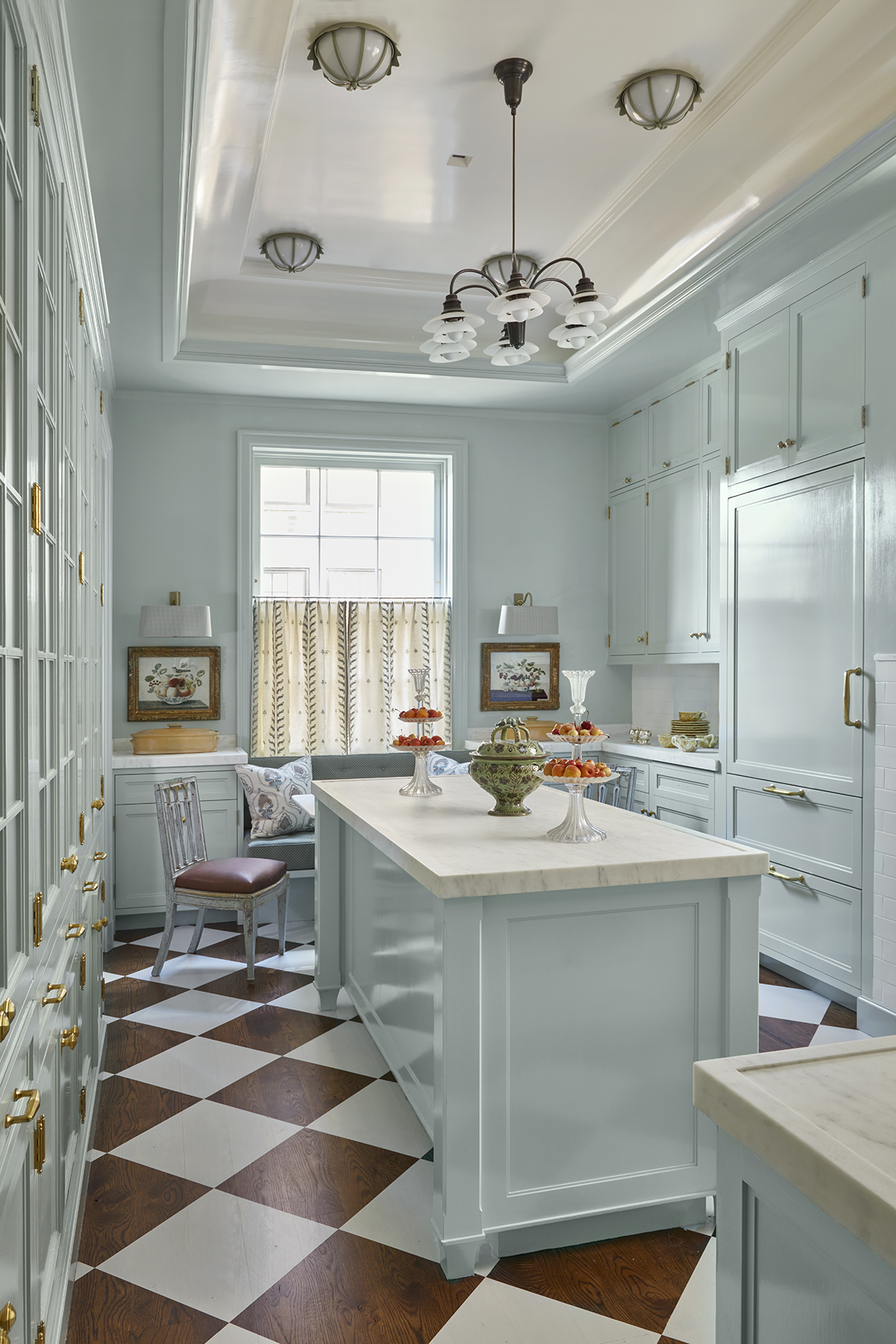 Light blue kitchen with bold checkered floor in a Cathy Kincaid designed Central Park home. #farrowandballlightblue
