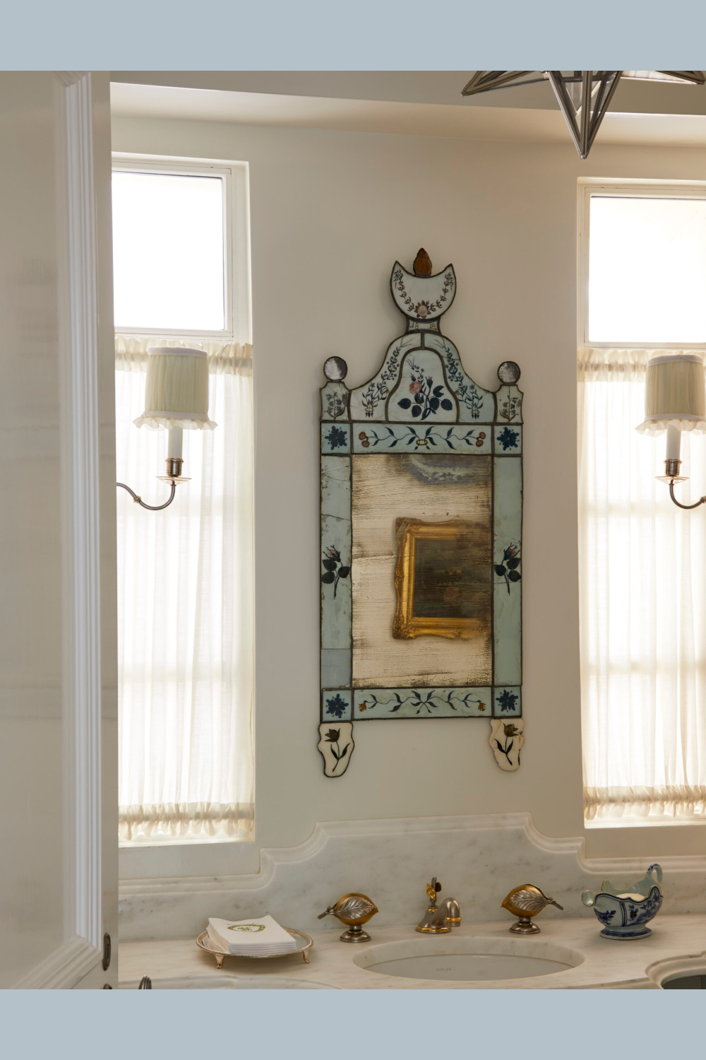 Powder bath with Venetian mirror in Cathy Kincaid designed interior at a Highland Park Beaux Arts home.