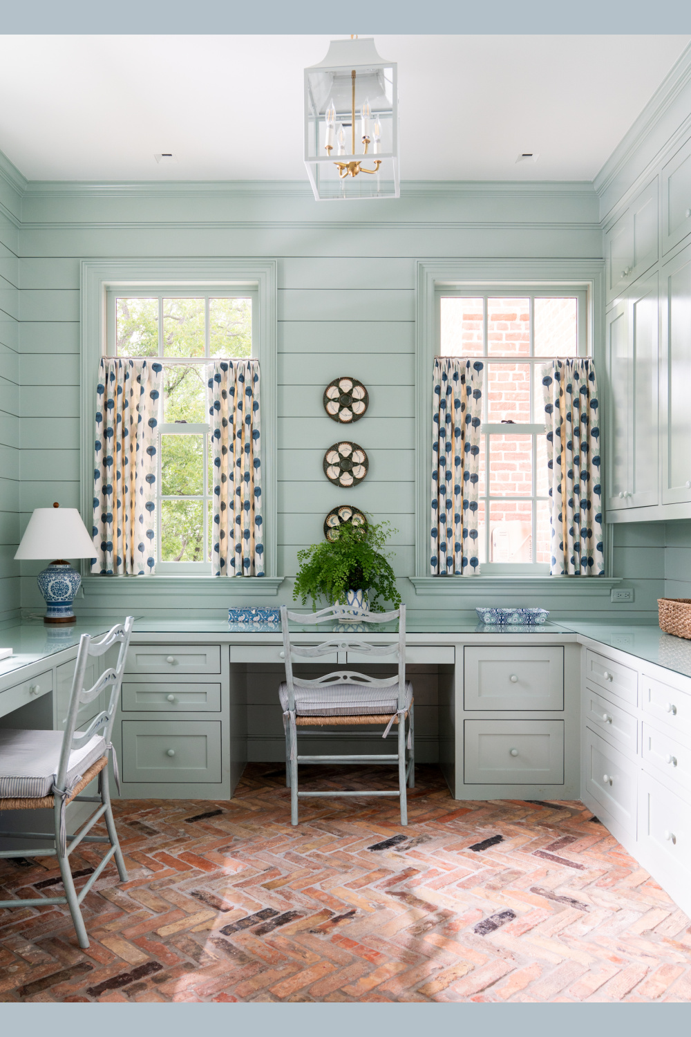Cheerful blue green in mudroom in a Cathy Kincaid designed historical Charleston home.