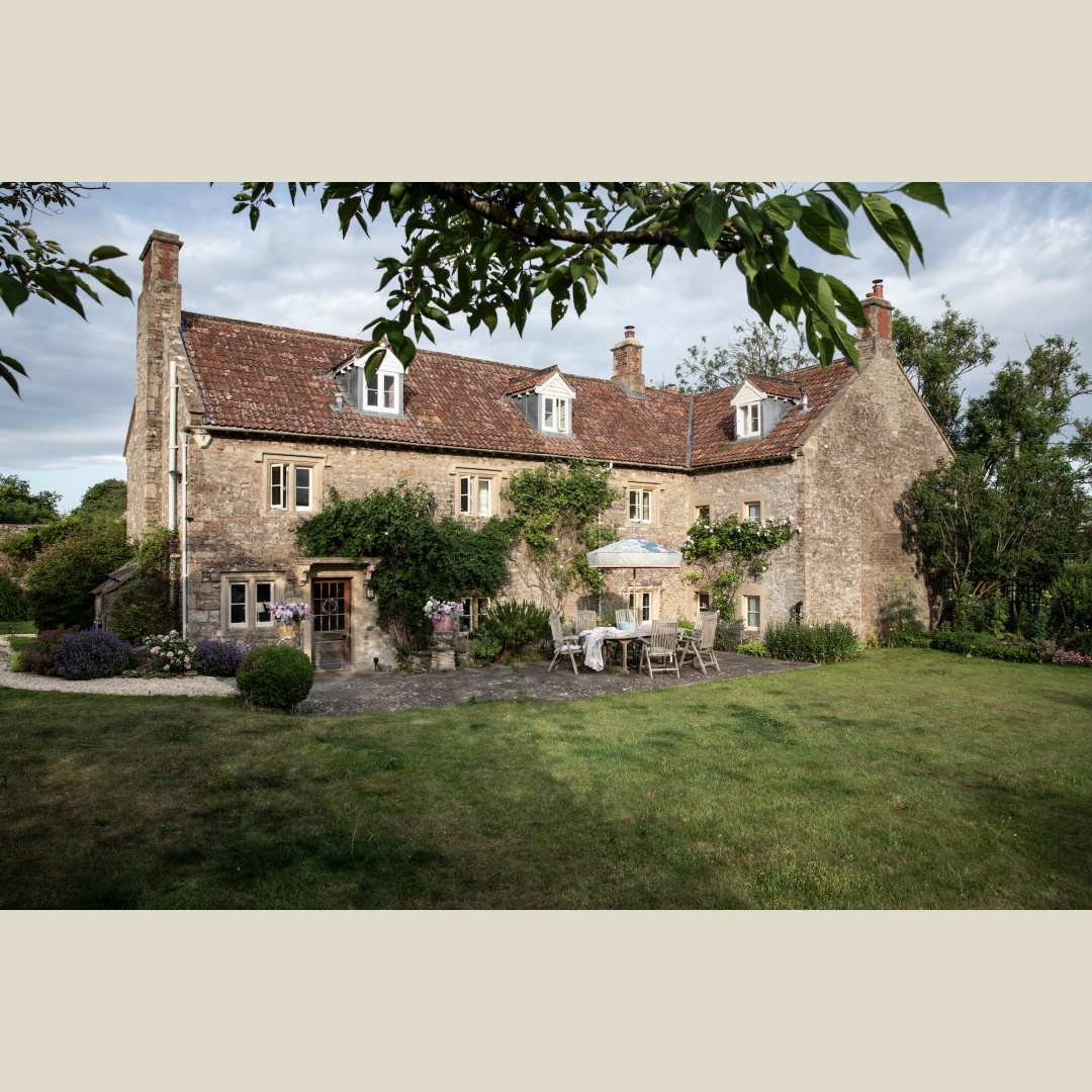 Exterior of 17th century stone house in English countryside. Rachel Ashwell's Meadow Manor in Somerset, England. Photo: Amy Neunsinger