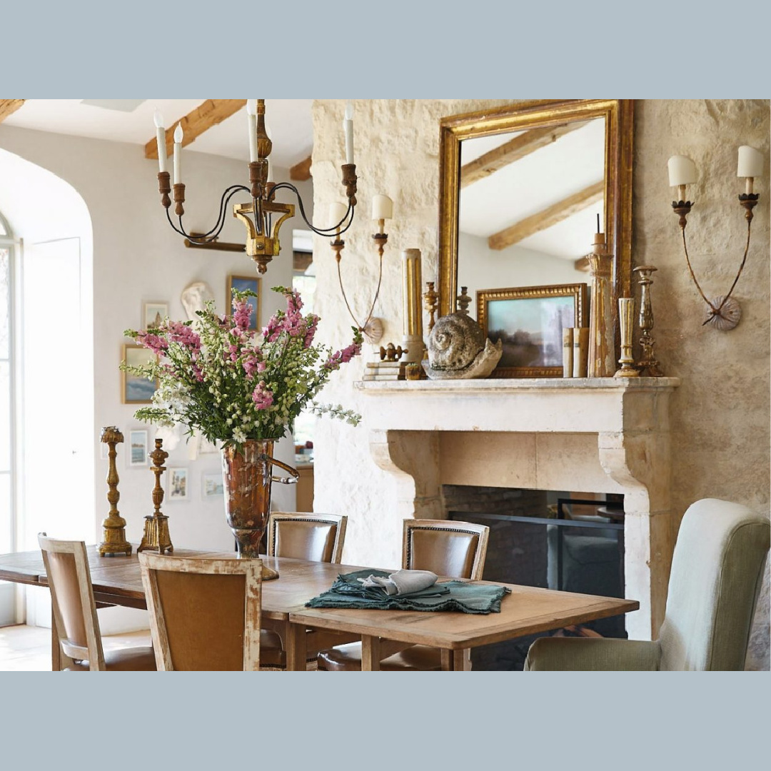 Patina Farm modern French dining room with French limestone fireplace and wall - design by Steve Giannetti and Brooke Giannetti. Photo by Victoria Pearson.