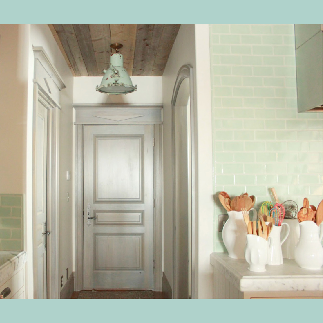 Custom grey-blue trim and antique pendant in kitchen. French, Belgian and Gustavian influences in a rustic elegant Utah cottage - Desiree Bastian of Beljar Home.