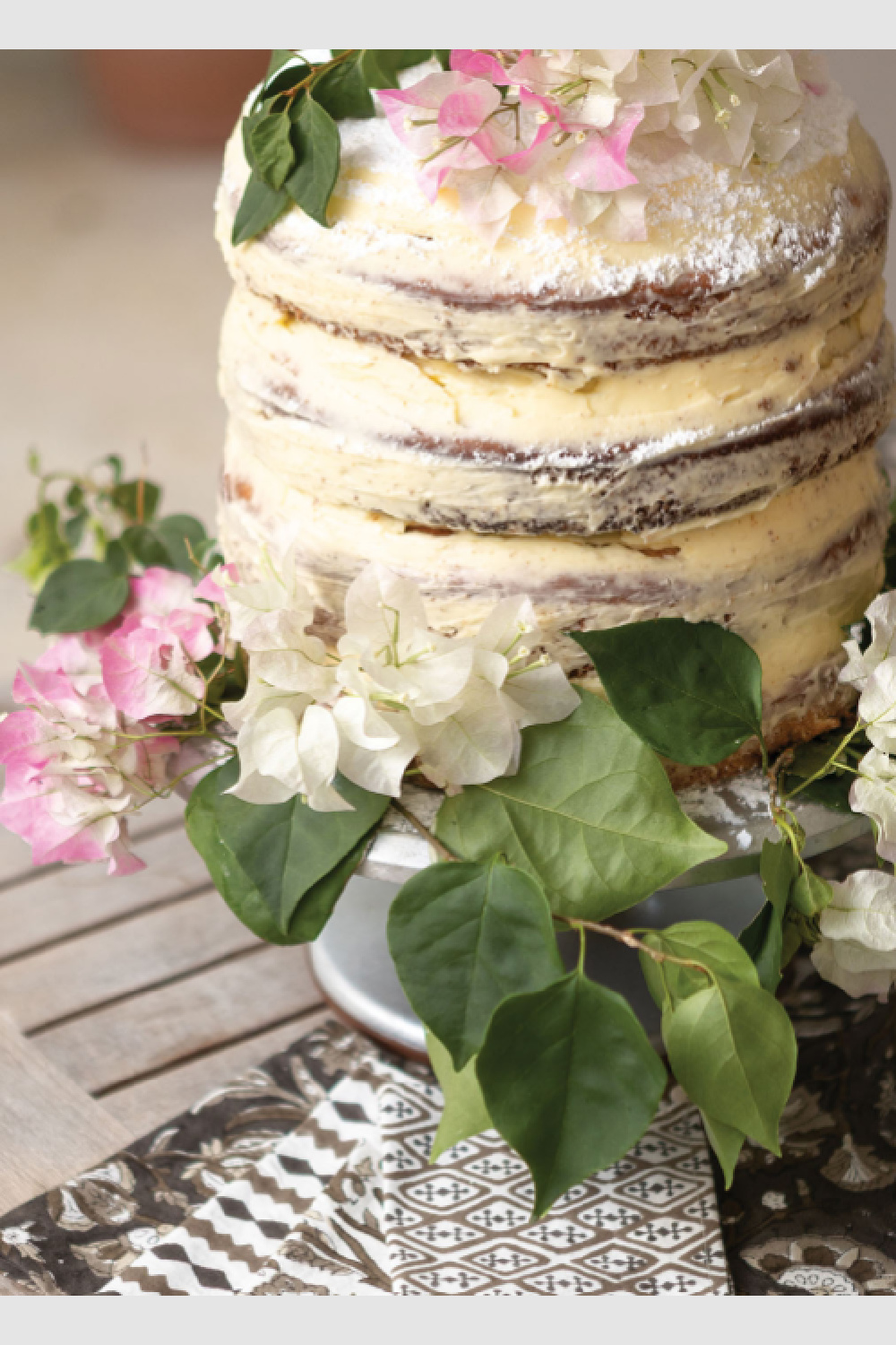 Beautiful naked layer cake from INDIA HICKS ENTERTAINING (Rizzoli, 2026)