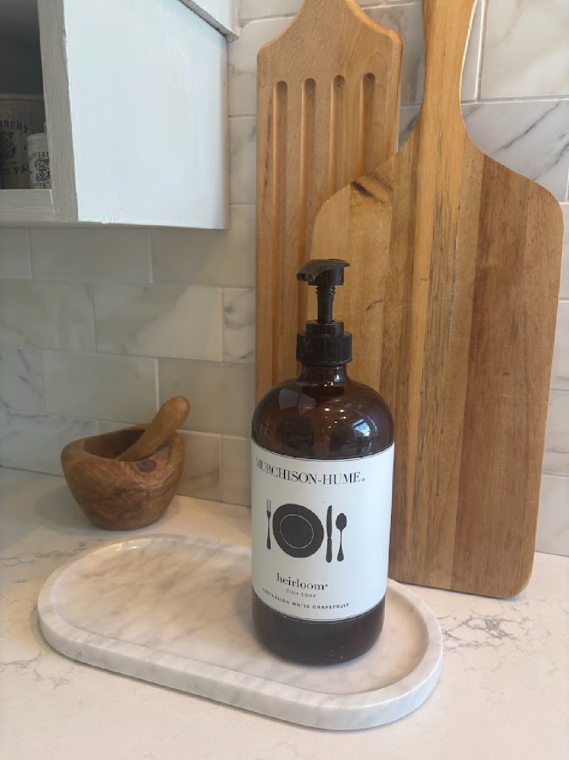 Marble oval tray with Murchison Home dish soap on Hello Lovely's counter (LX Hausys VIATERA Muse quartz).