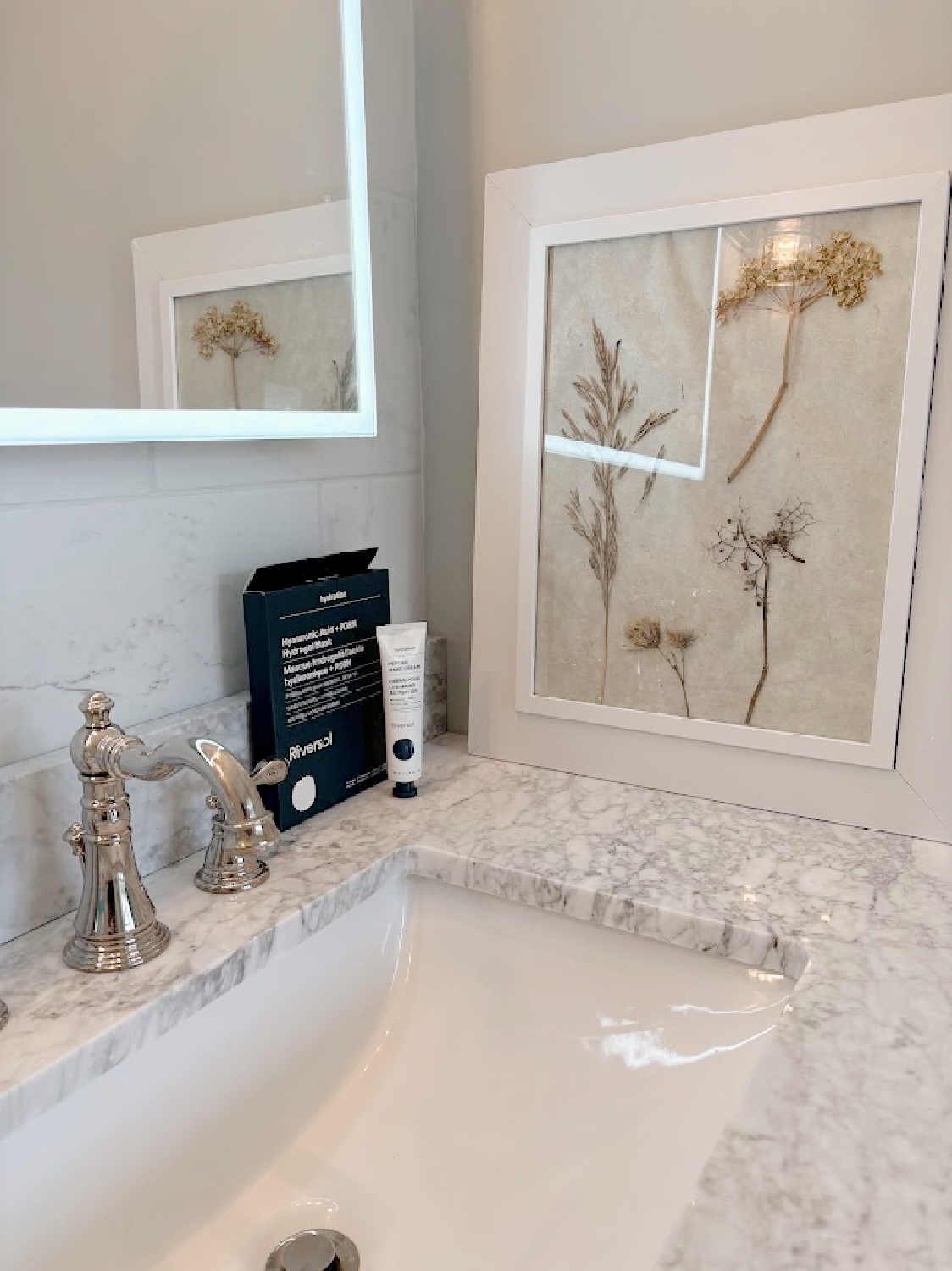 Riversol skincare (hand cream and masks) on Hello Lovely's marble vanity top.