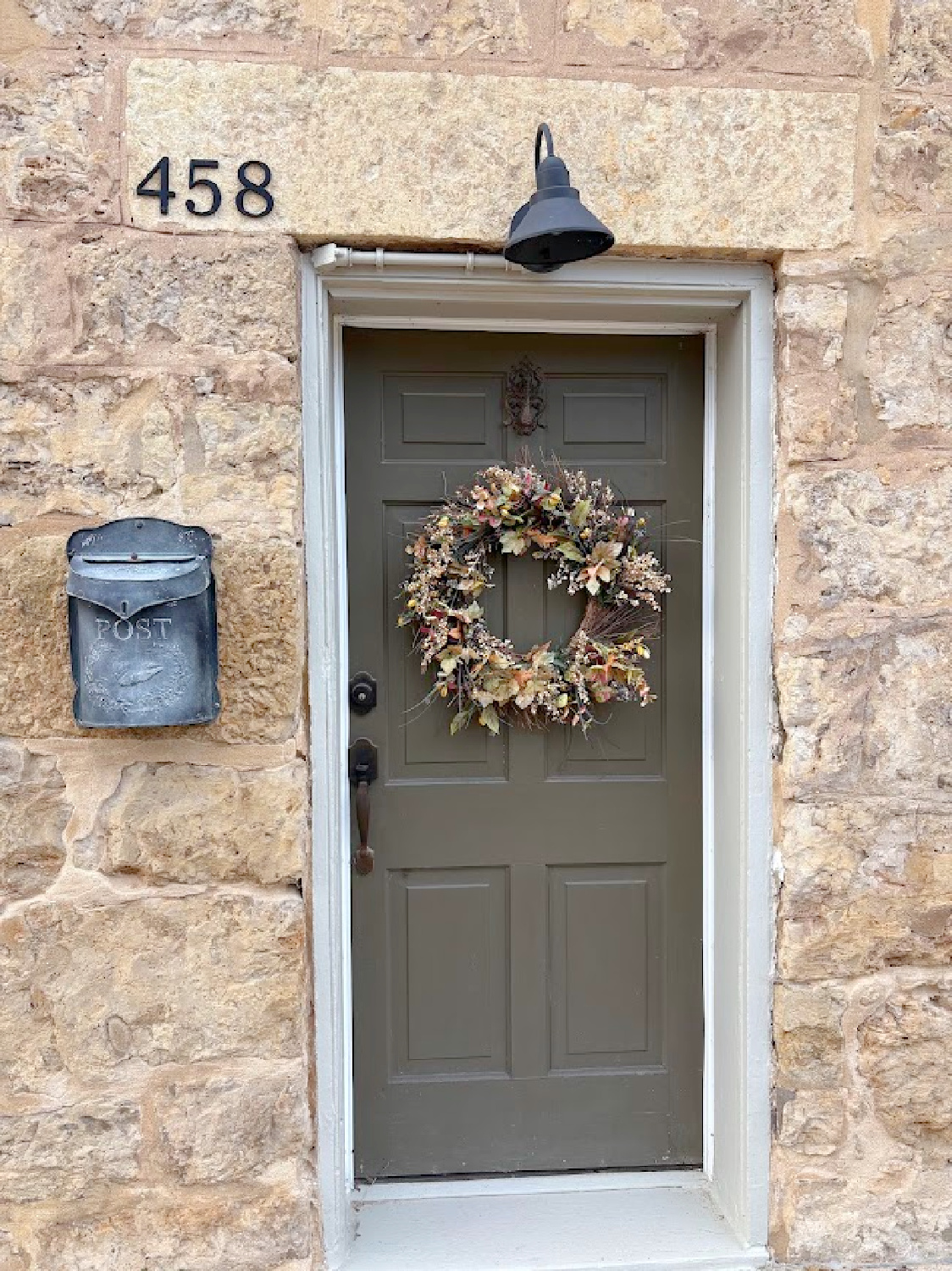 Front door with fall wreath - historic Galena, IL limestone house built in 1827 - Daniel Harrison House (458 Dewey Ave) - photo by Hello Lovely Studio.
