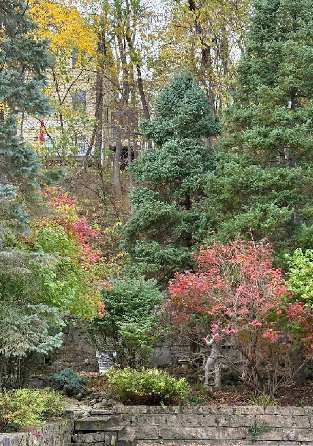 Garden in fall with autumn color. Historic Galena, IL limestone house built in 1827 - Daniel Harrison House (458 Dewey Ave) - photo by Hello Lovely Studio.