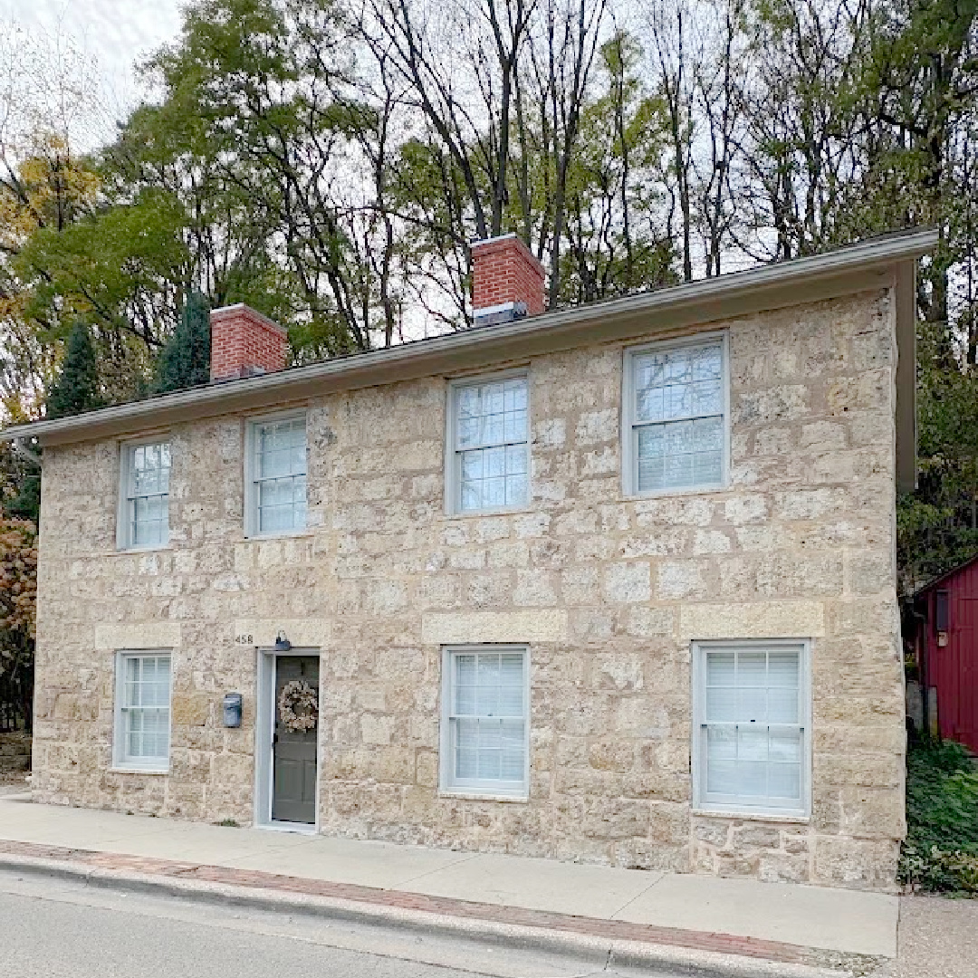 View from street. Historic Galena, IL limestone house built in 1827 - Daniel Harrison House (458 Dewey Ave) - photo by Hello Lovely Studio.