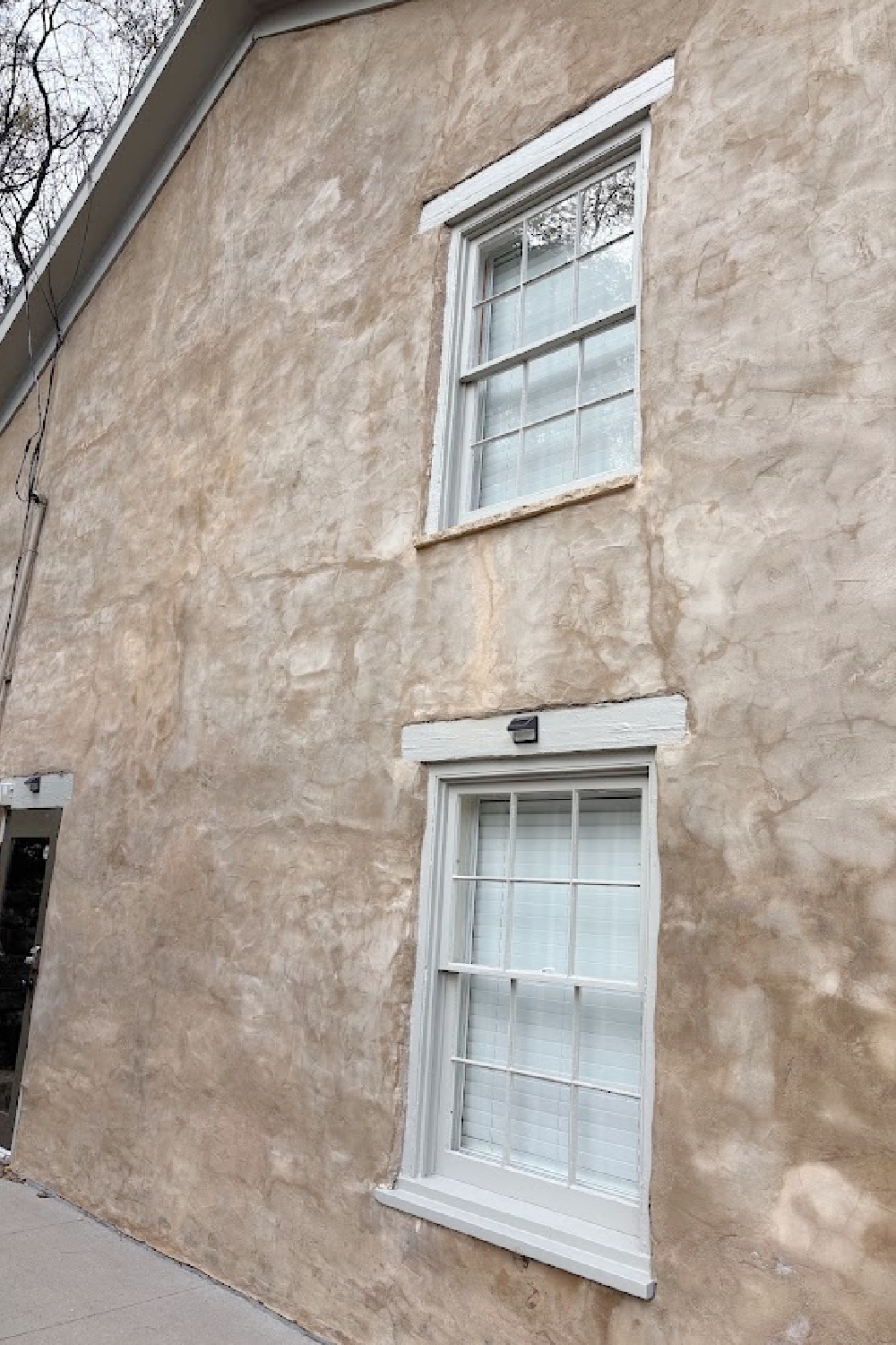Exterior of historic Galena, IL limestone house built in 1827 - Daniel Harrison House (458 Dewey Ave) - photo by Hello Lovely Studio.