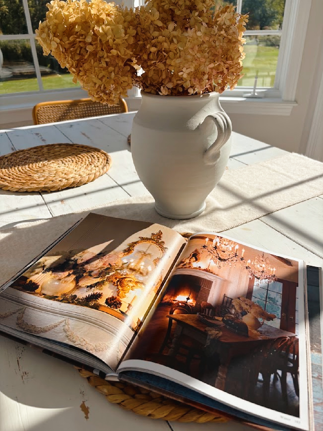 French Country Cottage Seasons (Gibbs Smith, 2026) by Courtney Allison on Hello Lovely's white farm table.